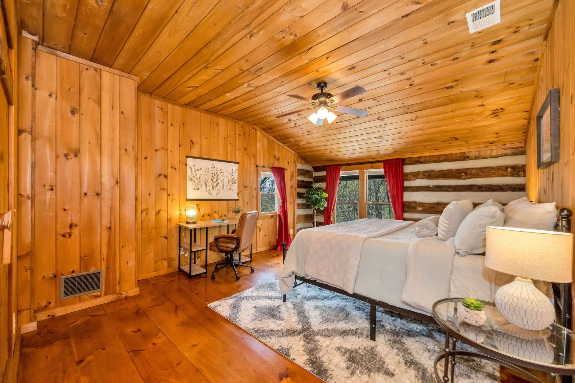 A second guest room with space for a desk or sitting area.