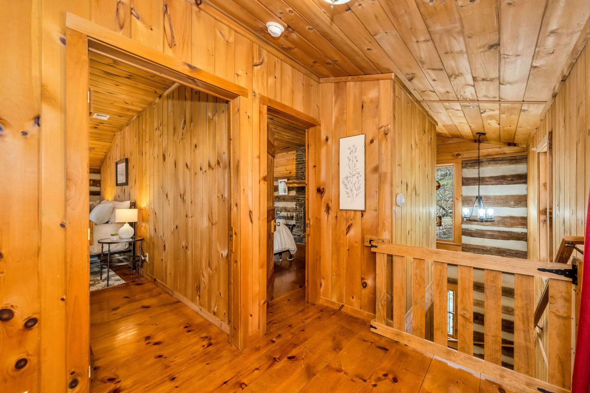 Upper level hallway with a custom gate to keep toddlers or fur babies safe.