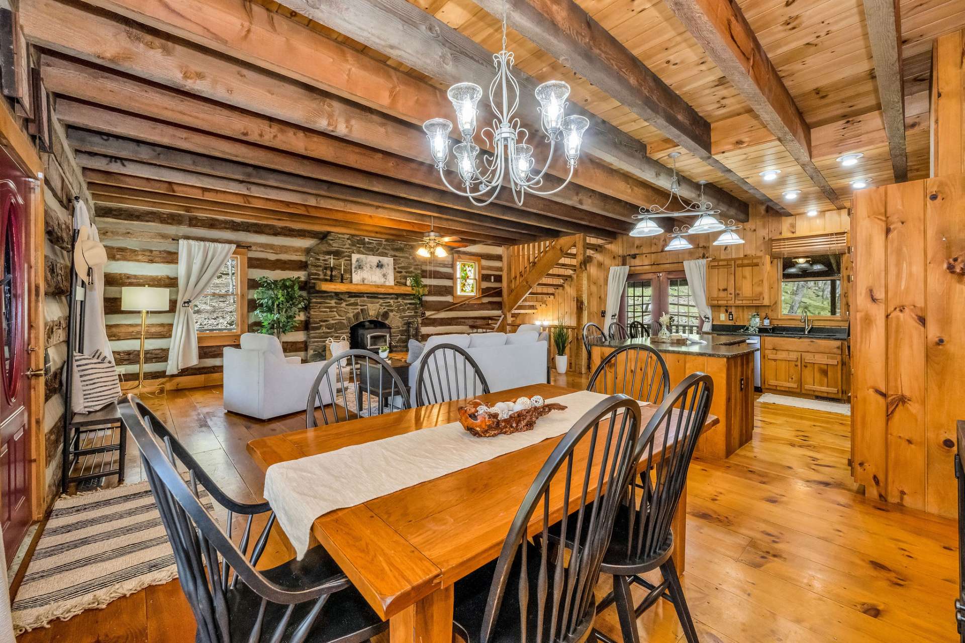 The dining room table and all black chairs convey with the cabin.