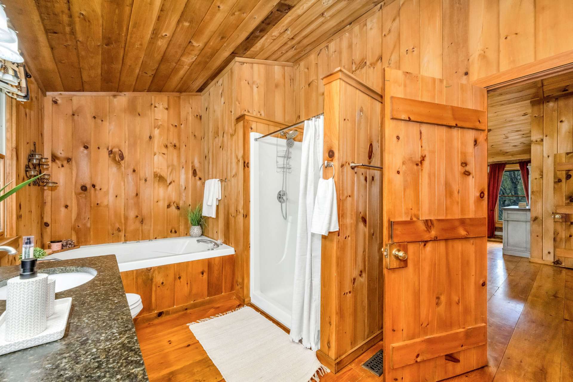 Featuring a deep soaking tub, a spacious walk-in shower, and double sinks for both comfort and convenience