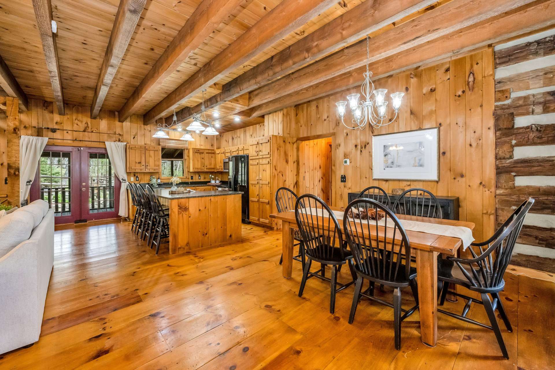 The great room opens up to a screened porch to add to your living and entertaining space.