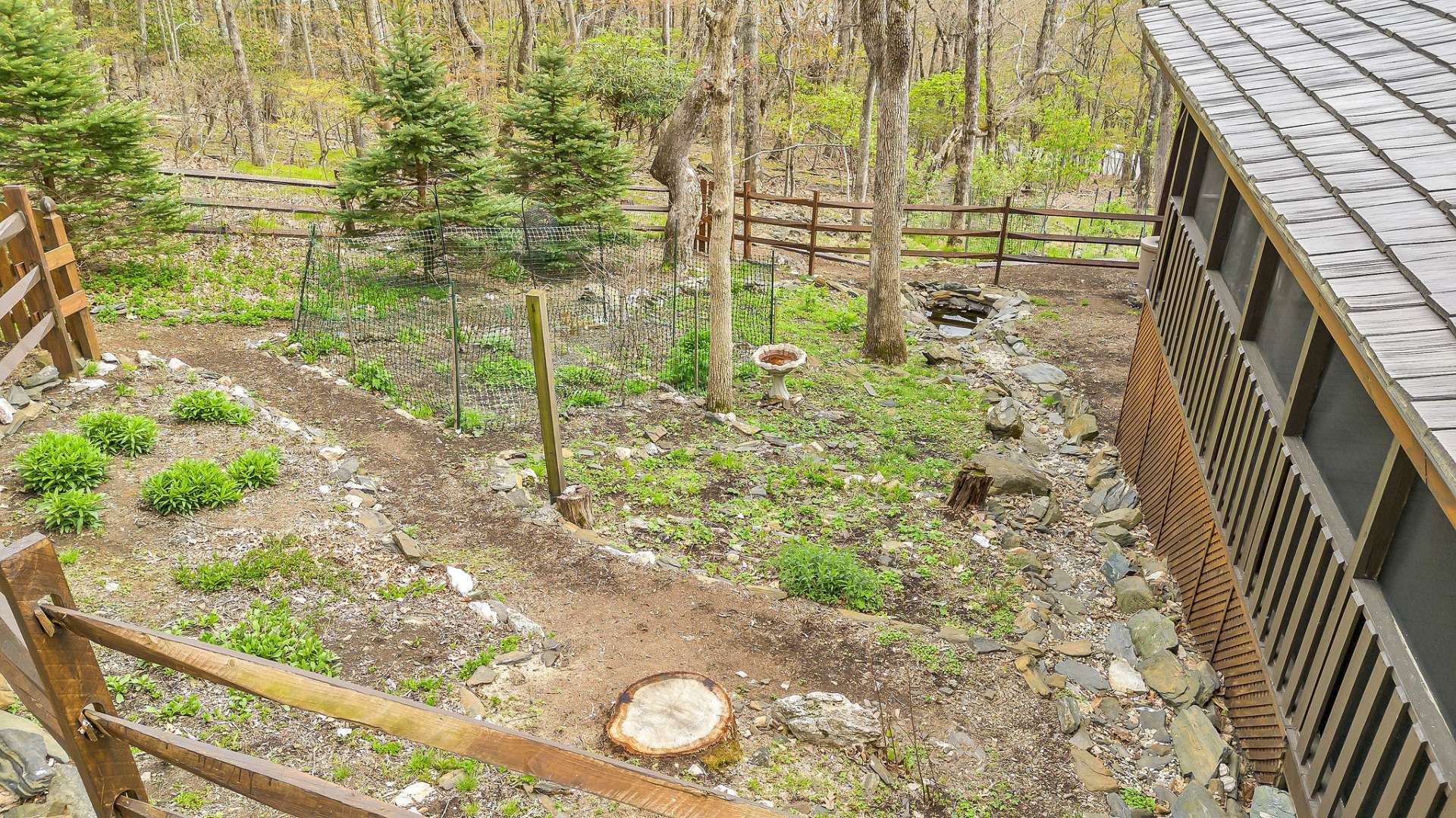 The backyard area is partially fenced.