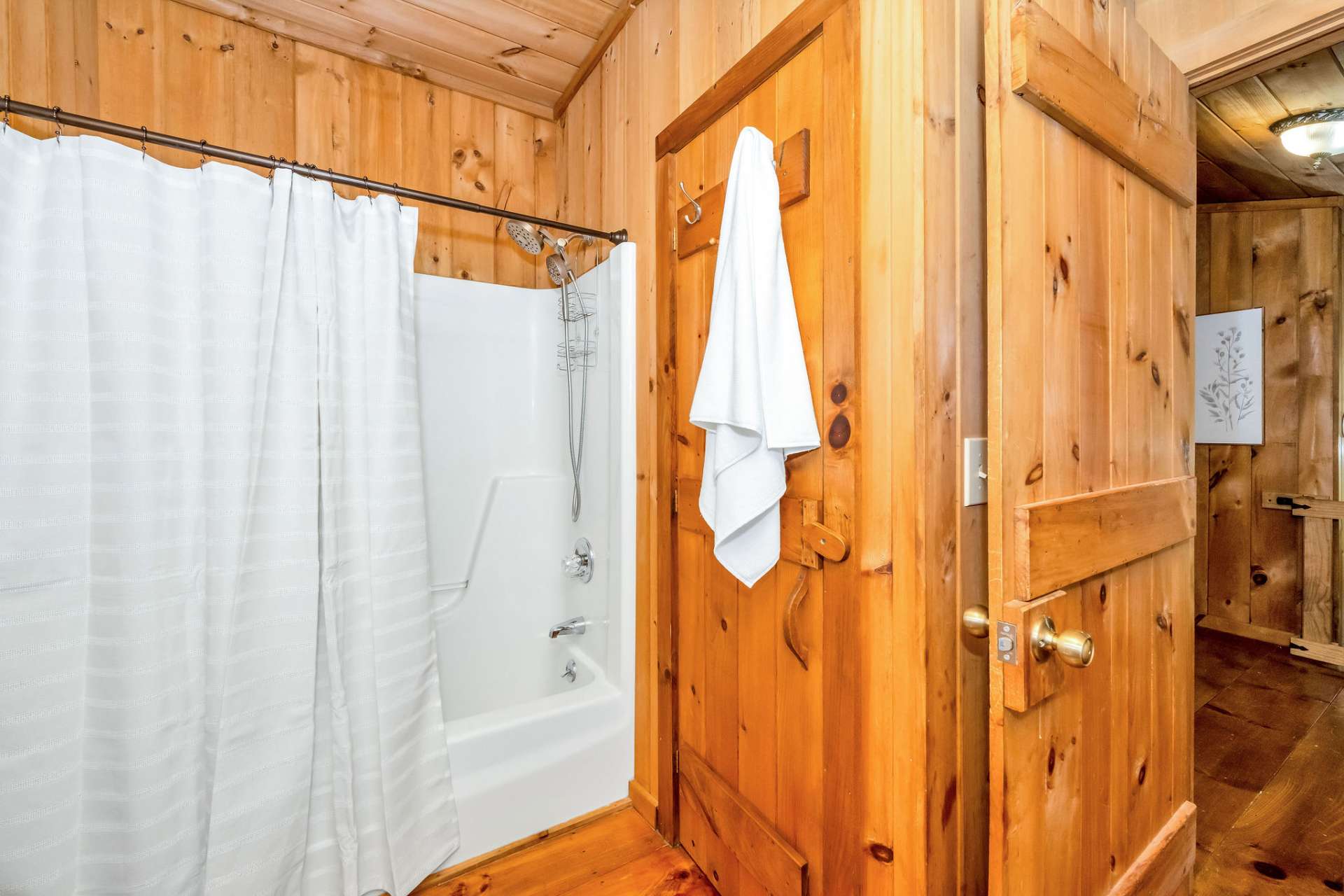 The upper-level full bath has a tub shower combo.