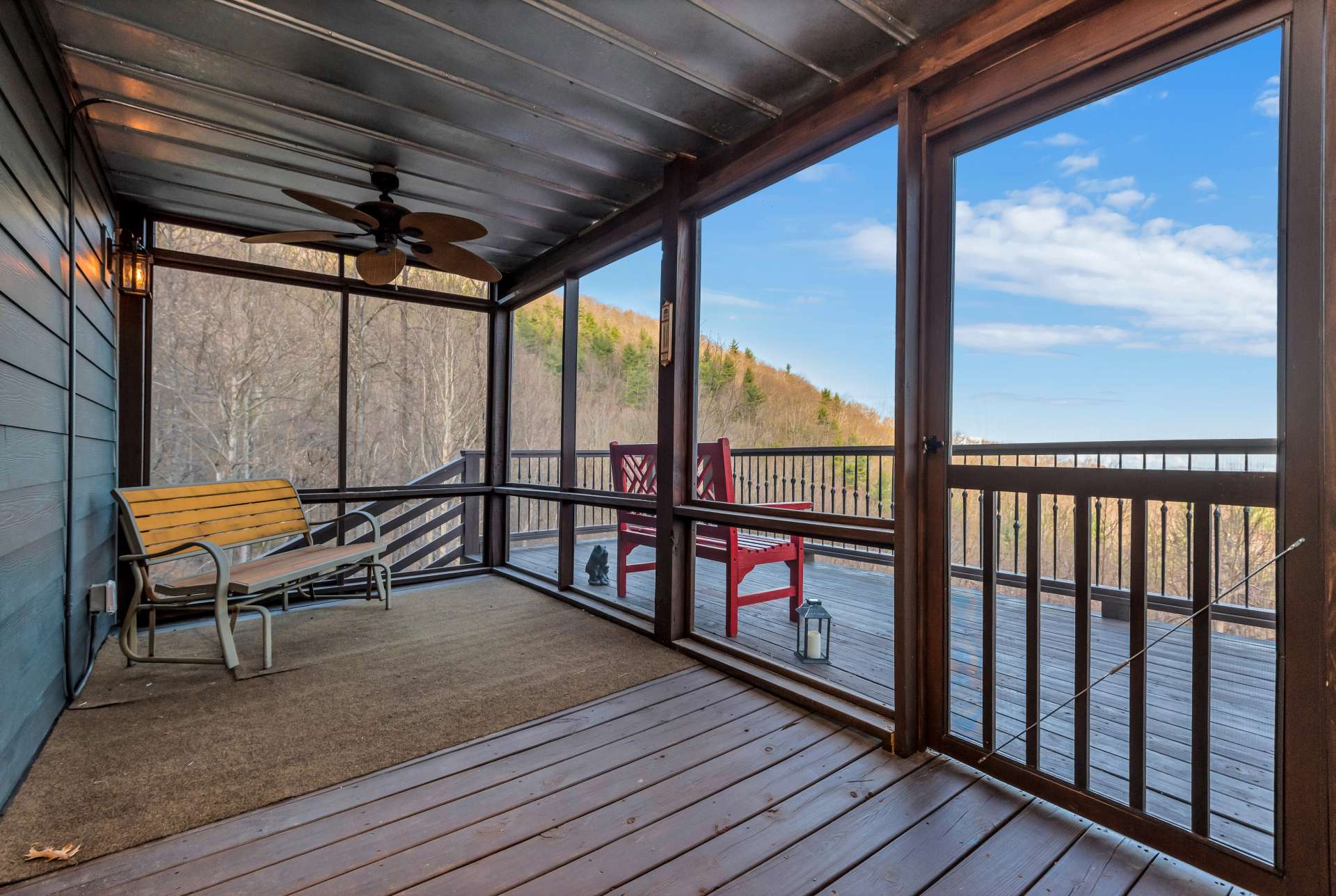 Screened in porch off of the living room is a great place for outdoor dining and enjoying the fresh mountain air.