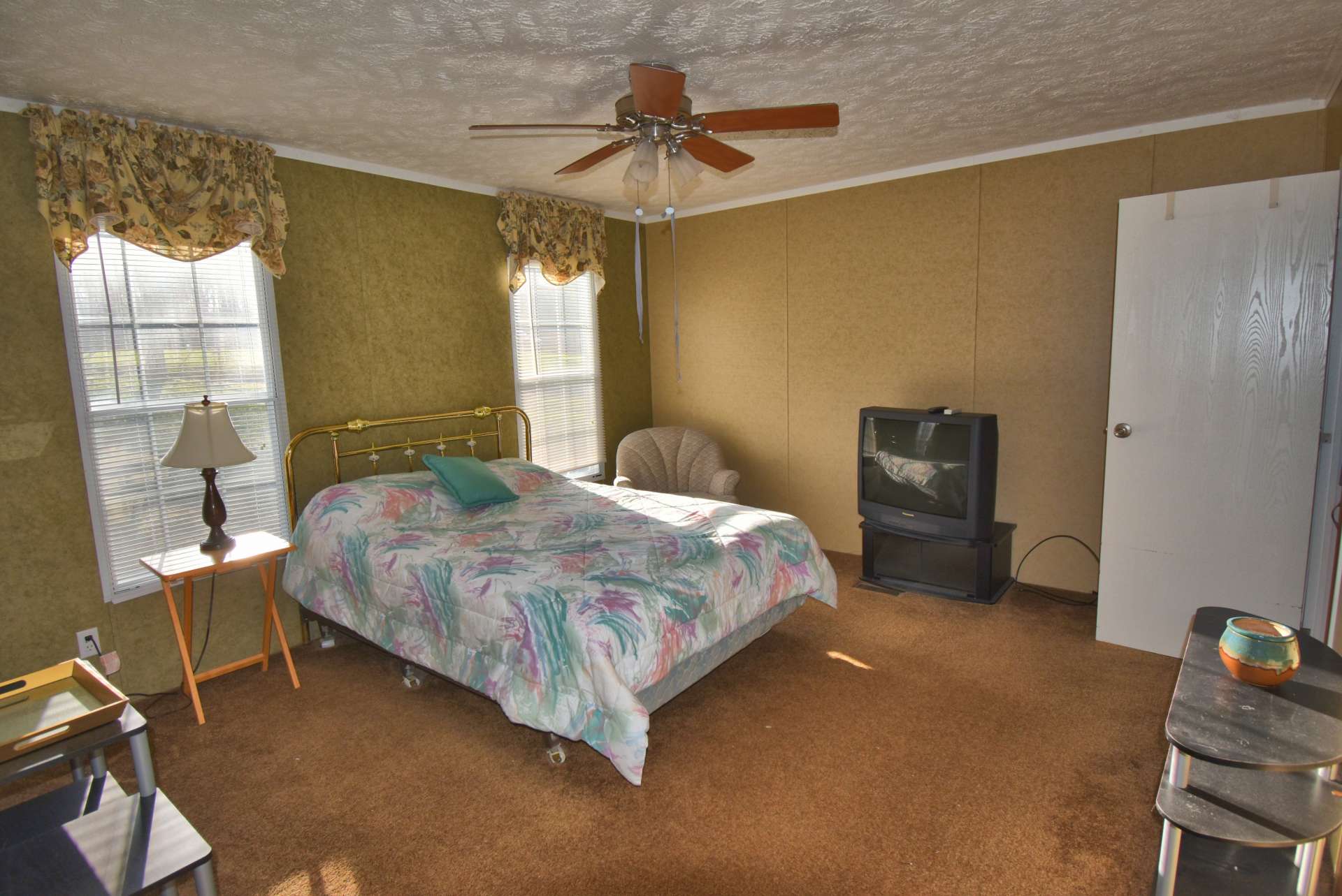 A large master suite features a private bath.