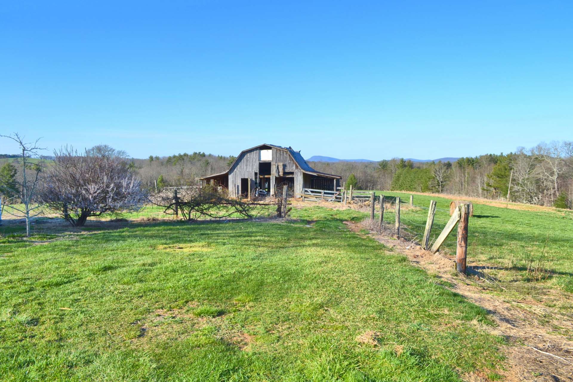 There are two barns, outbuilding, and fenced pastures providing mini farm option.  Livestock,  crops, or horses  would be reasonable choices for this sweet farm.