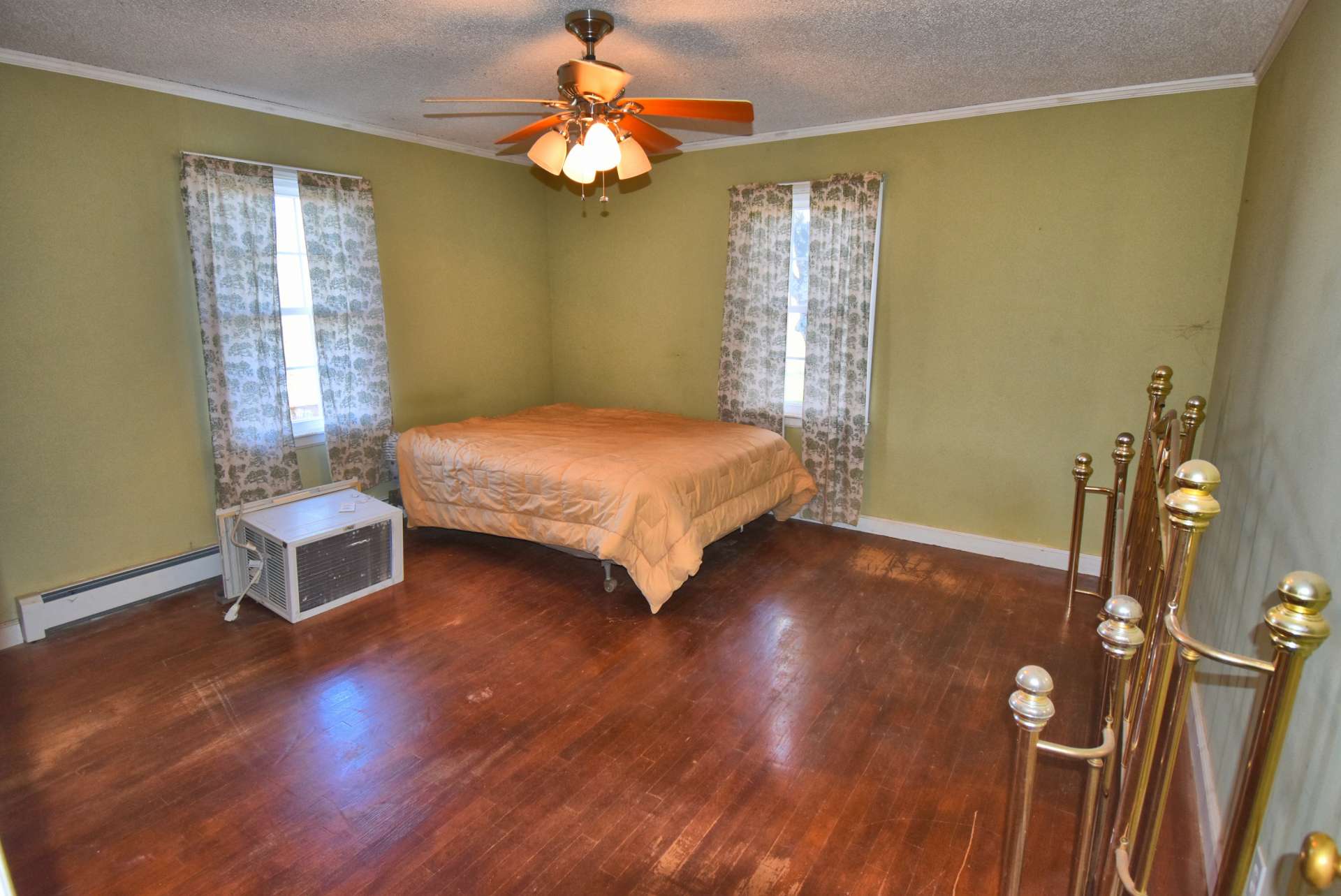 Main bedroom with wood floors.