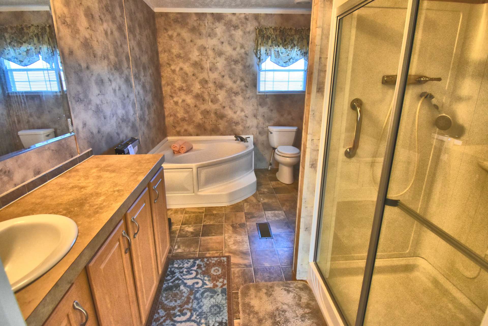 The master bath offers s large garden tub and separate walk-in shower.