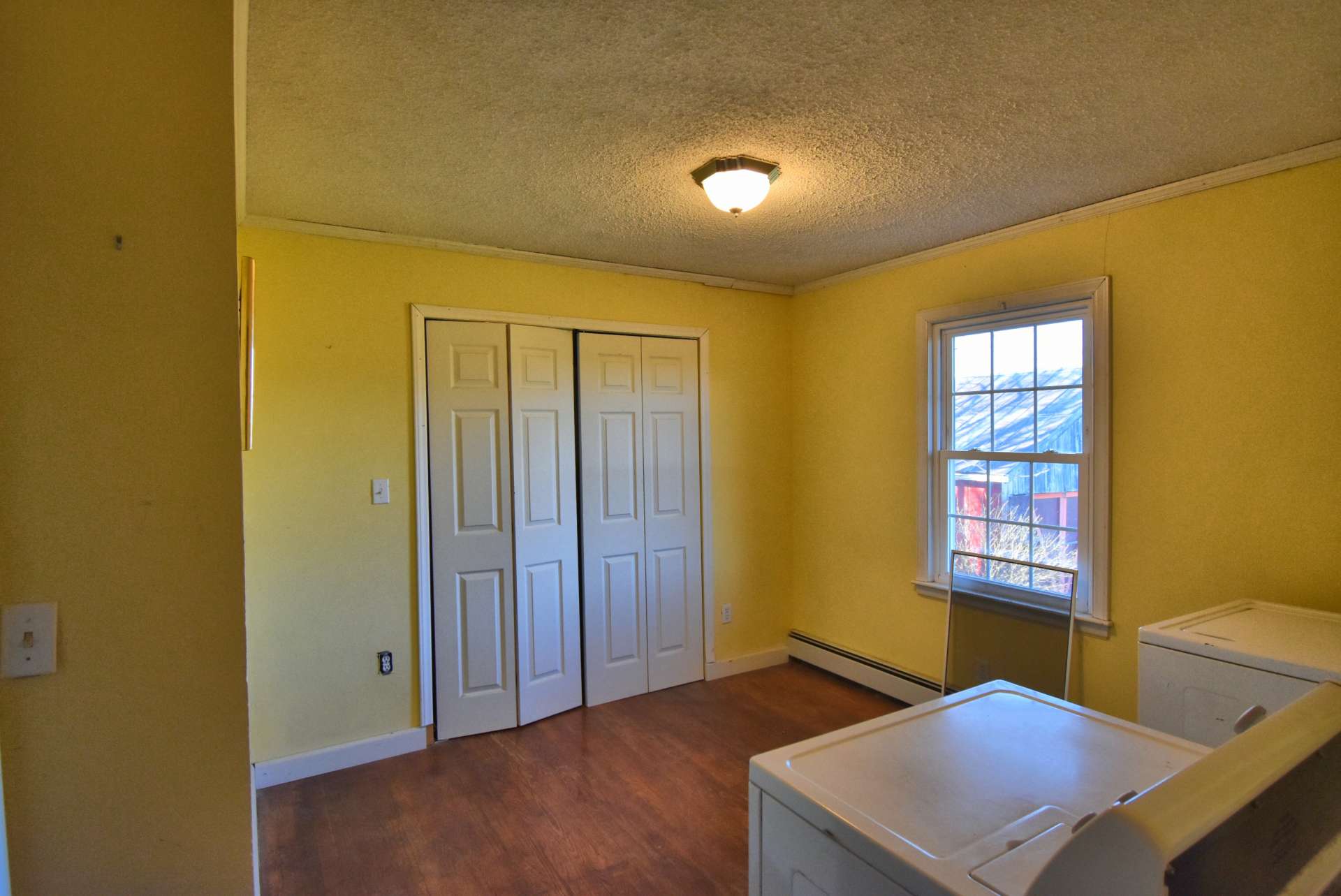 The second bedroom was previously used as large laundry room and storage, but can easily be converted back to sleeping space.