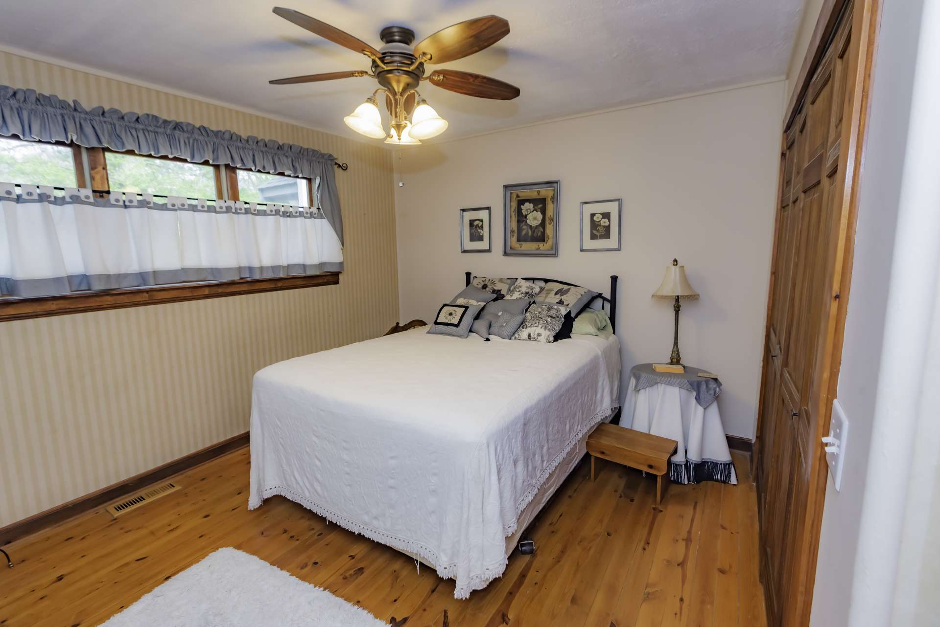 There are two generously sized guest bedrooms and a full bath on the main level, as well.