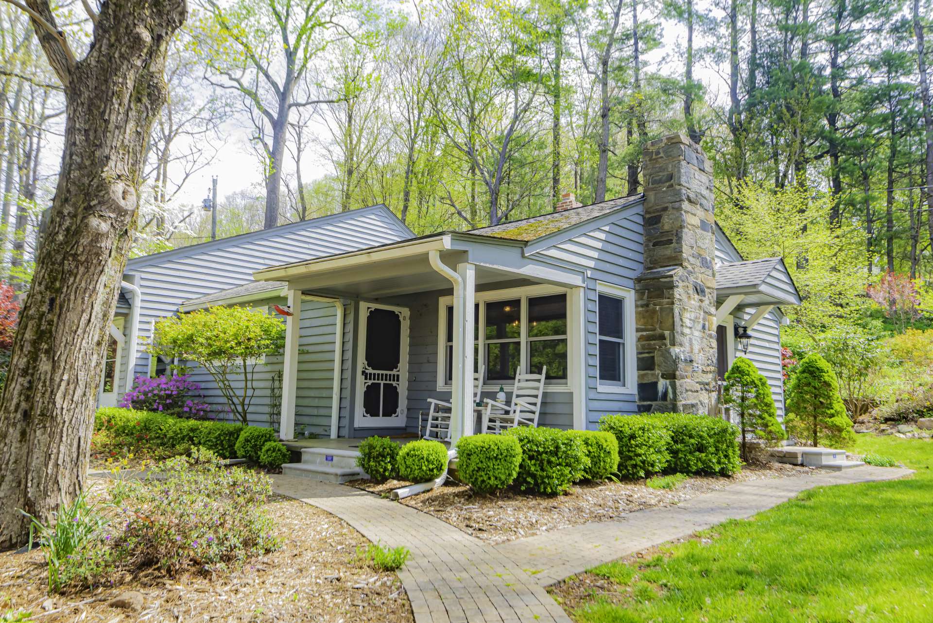 A covered front porch is perfect for relaxing at the end of the day with your favorite beverage and the views.