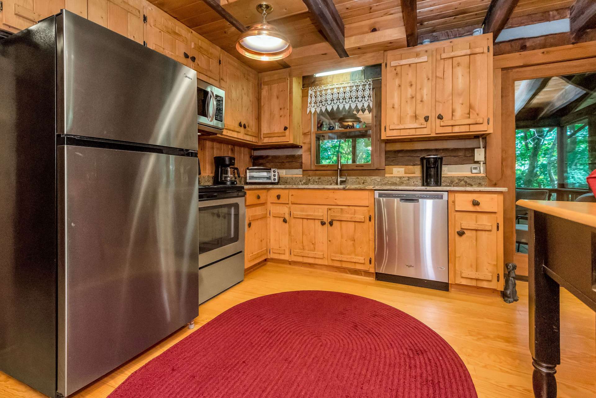 Kitchen features granite counter tops, stainless appliances, and custom cabinets.