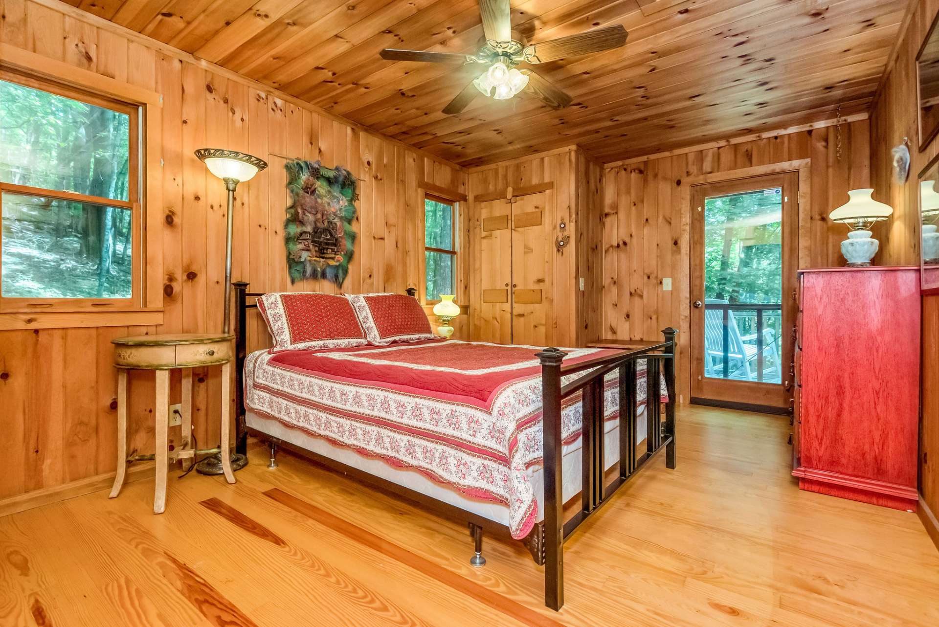 Primary bedroom has access to the open deck, and offers dual closets.