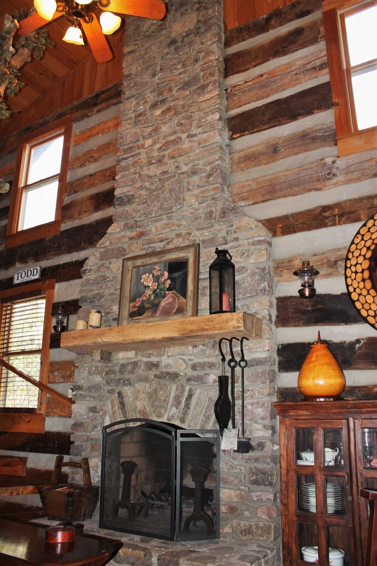 This two story stone fireplace, flanked by windows, is certainly the focal point of the great room and provides added warmth on chilly winter evenings.