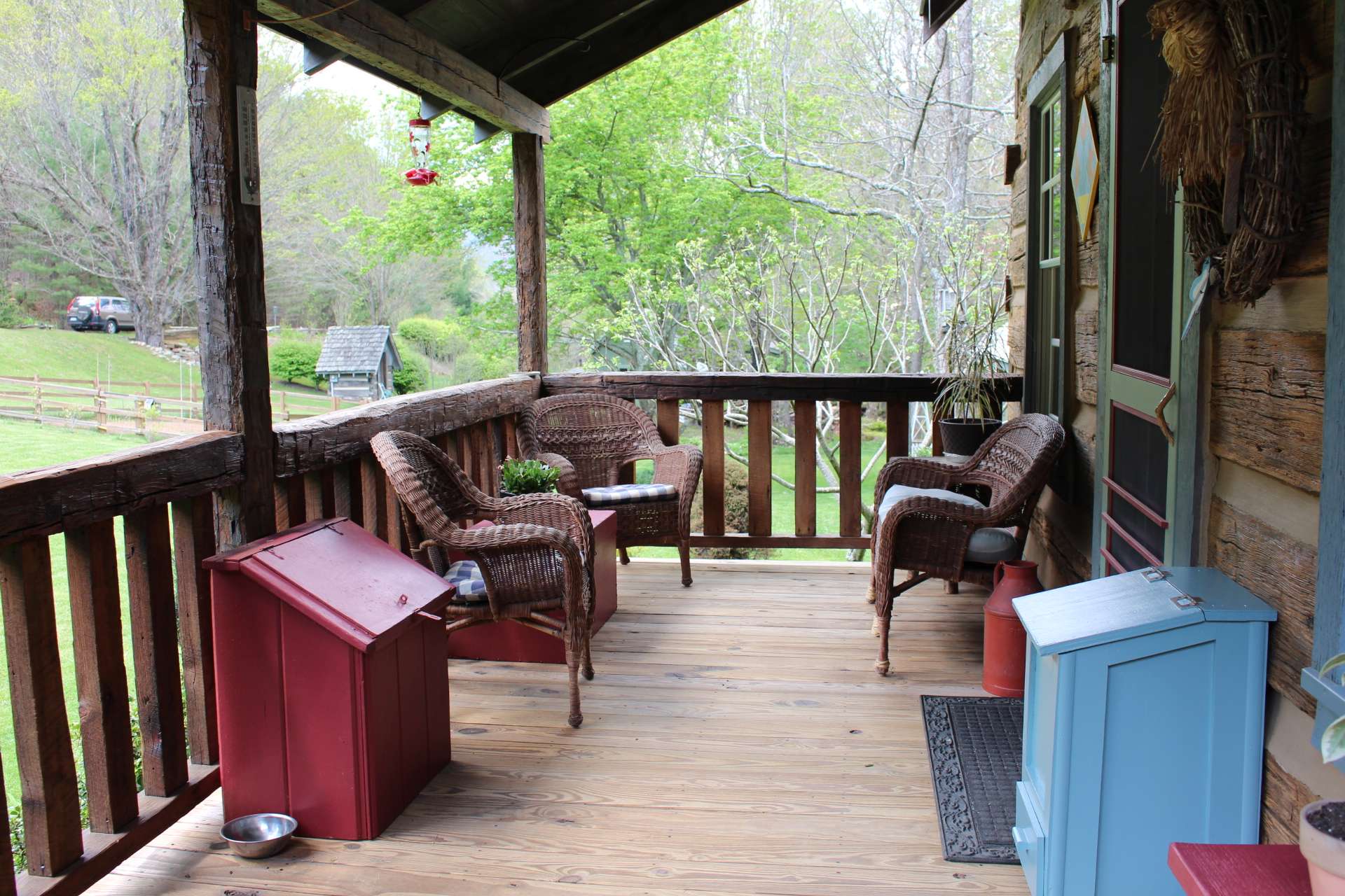 Enjoy the views and the sounds of a noisy little creek while sipping iced tea on the nice covered front and side porch.