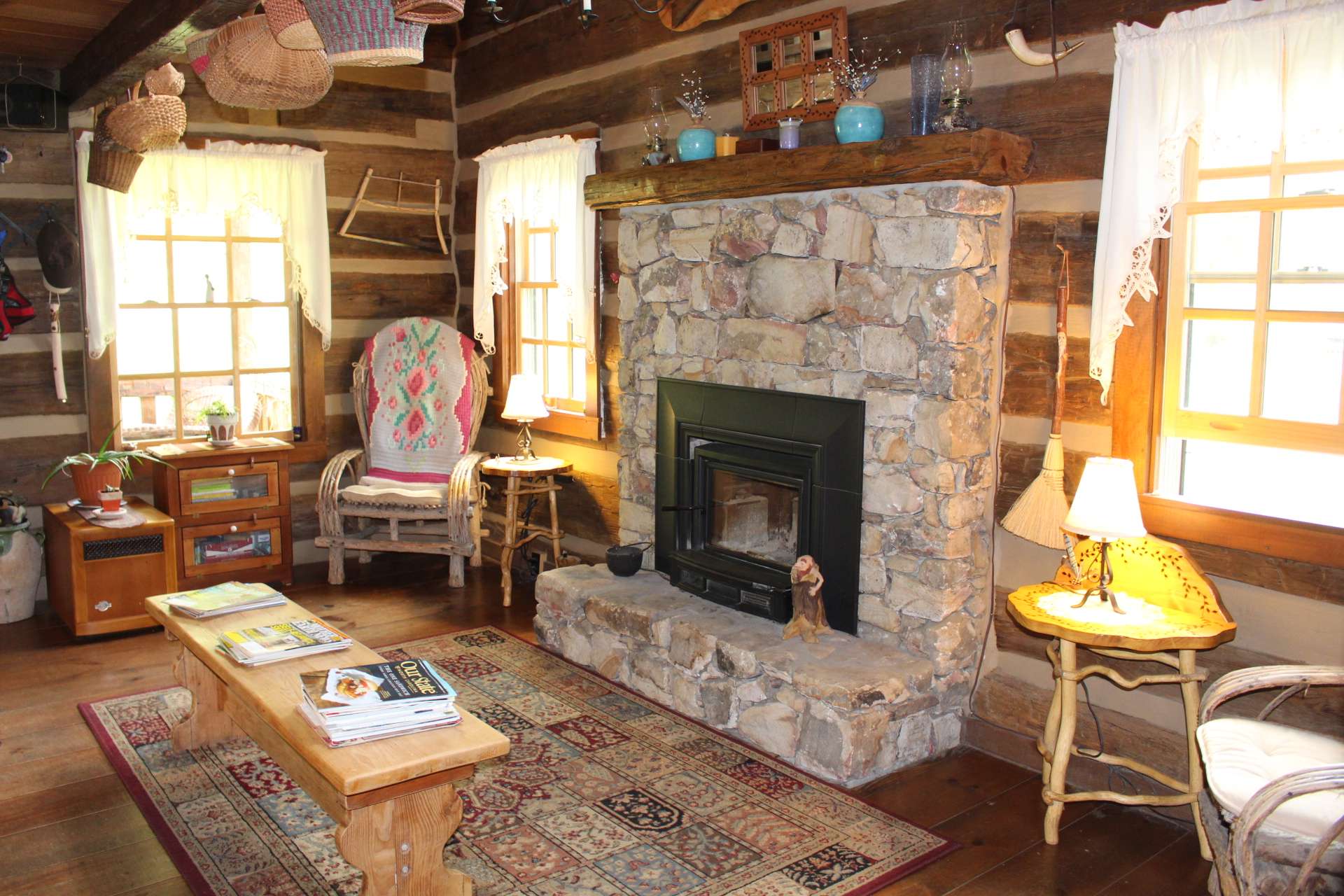 This log cabin is designed to warm your hands and your heart with the stone fireplace in the vaulted great room.