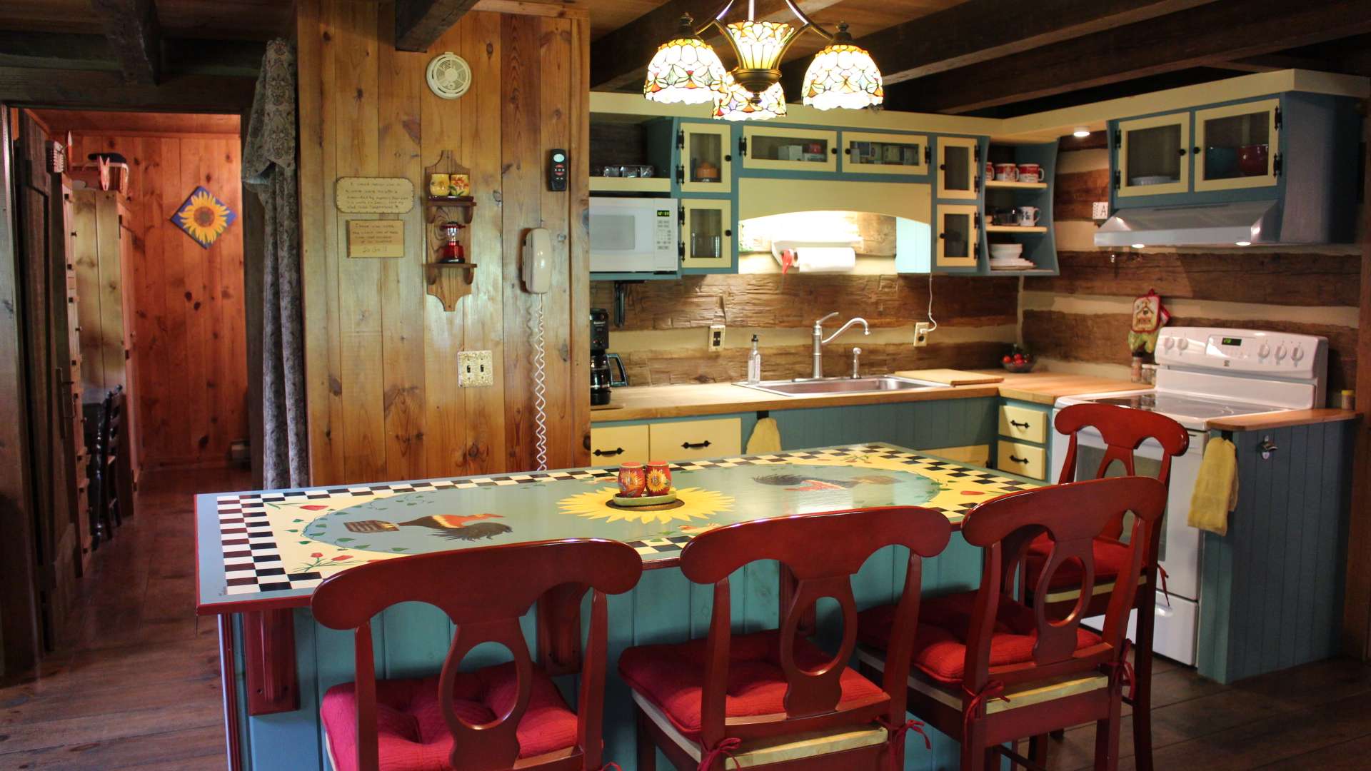 Also enjoy the fireplace from the cozy kitchen with custom island and new cabinets.