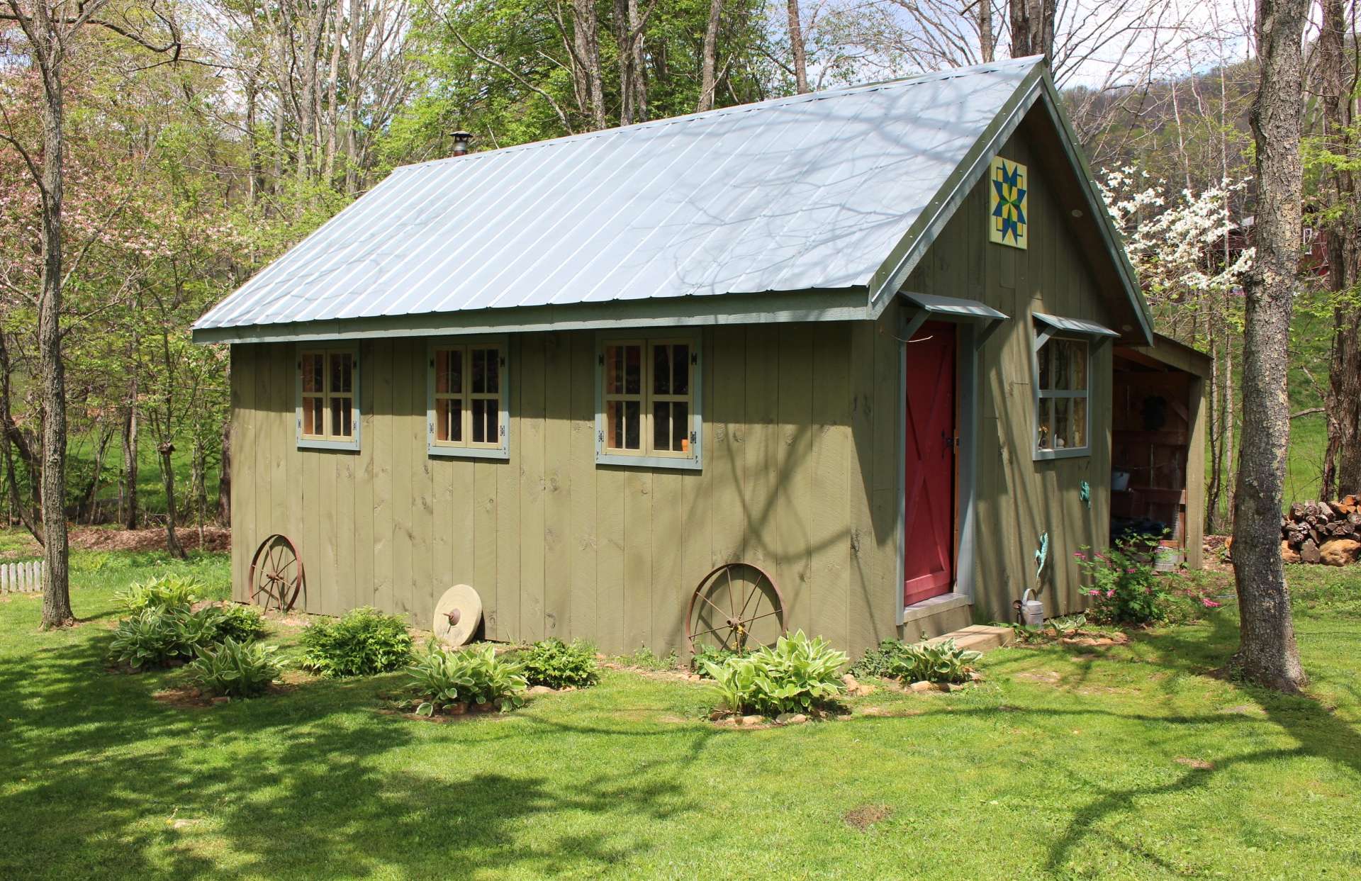 This craftsman style outbuilding offers multiple possibilities as workshop or bunkhouse.