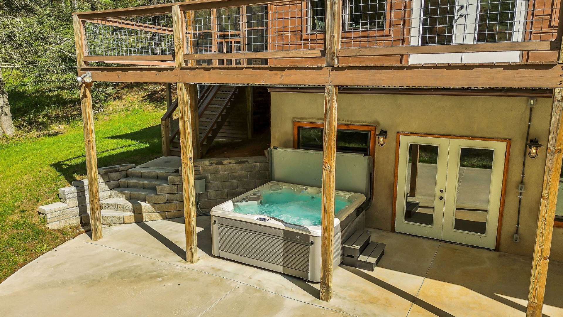 Just outside the family room is the hot tub, inviting you to indulge in a relaxing soak while breathing in the fresh mountain air.