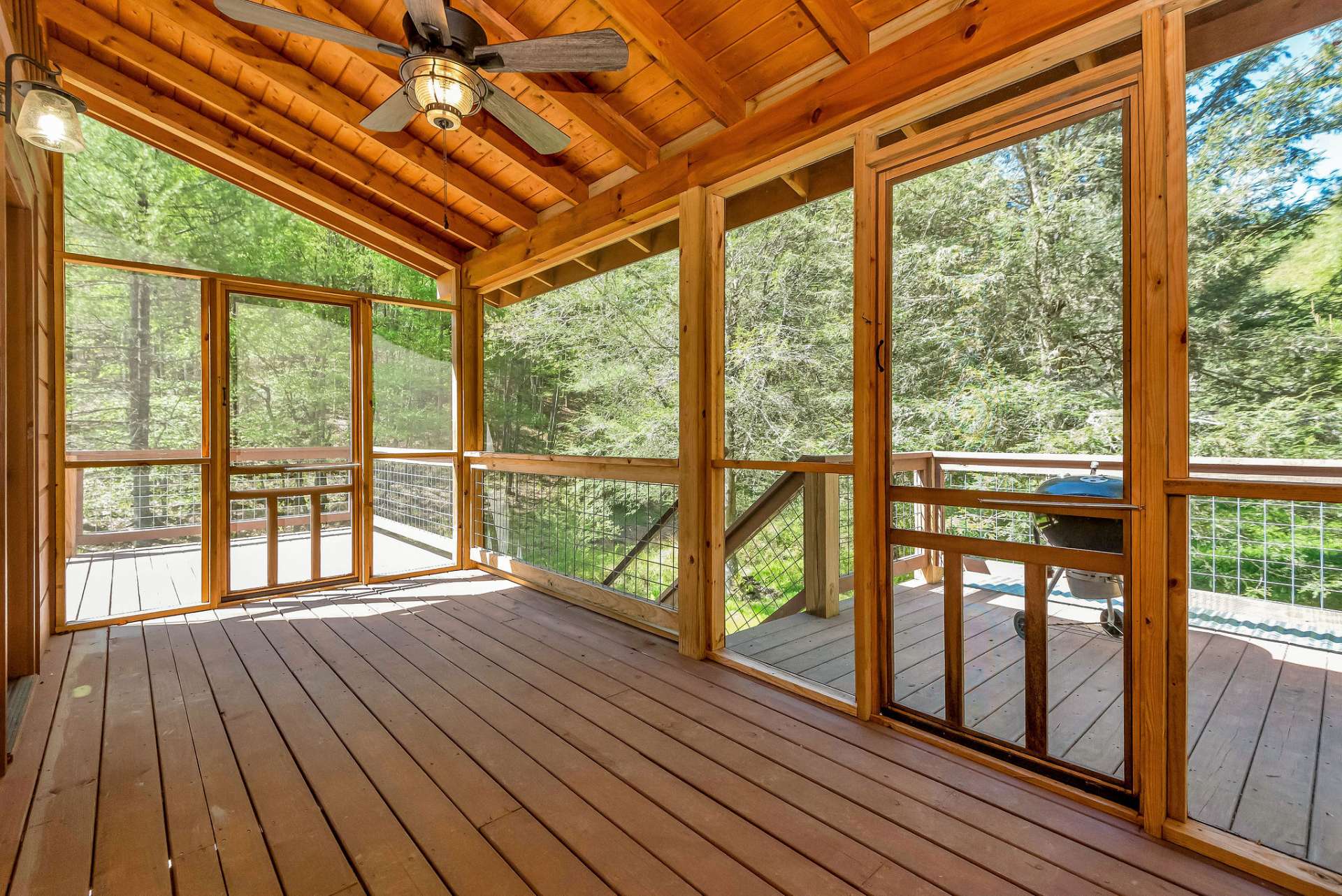 Stay cool and relax on the screened porch on the back.