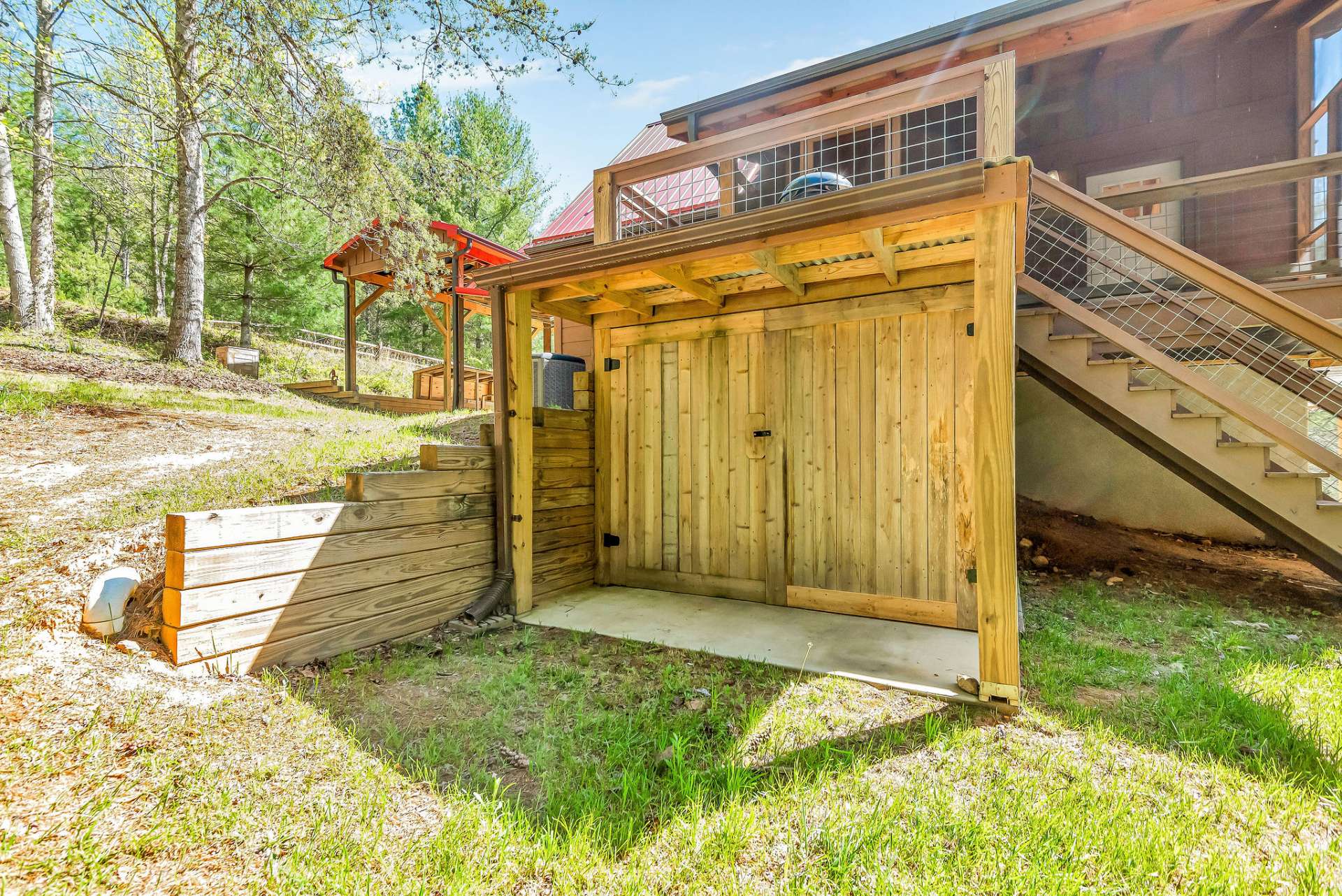 Around the back, underneath the deck, you'll find additional storage space, providing practical solutions for keeping your outdoor belongings organized and easily accessible.