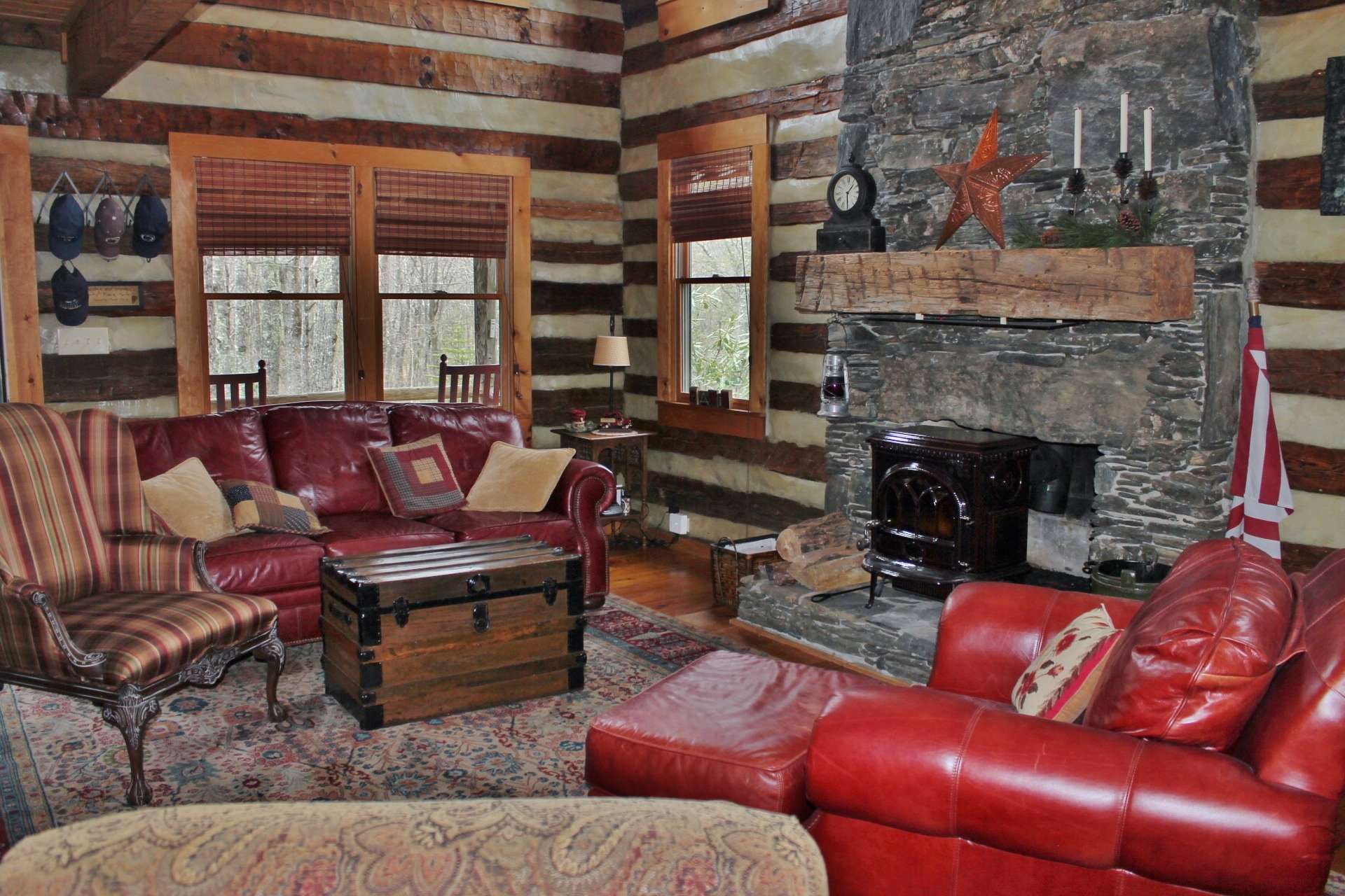 This cabin offers a great room complete with a floor to ceiling stacked stone wood burning fireplace. A wood stove has been added recently to increase efficiency during the winter months.