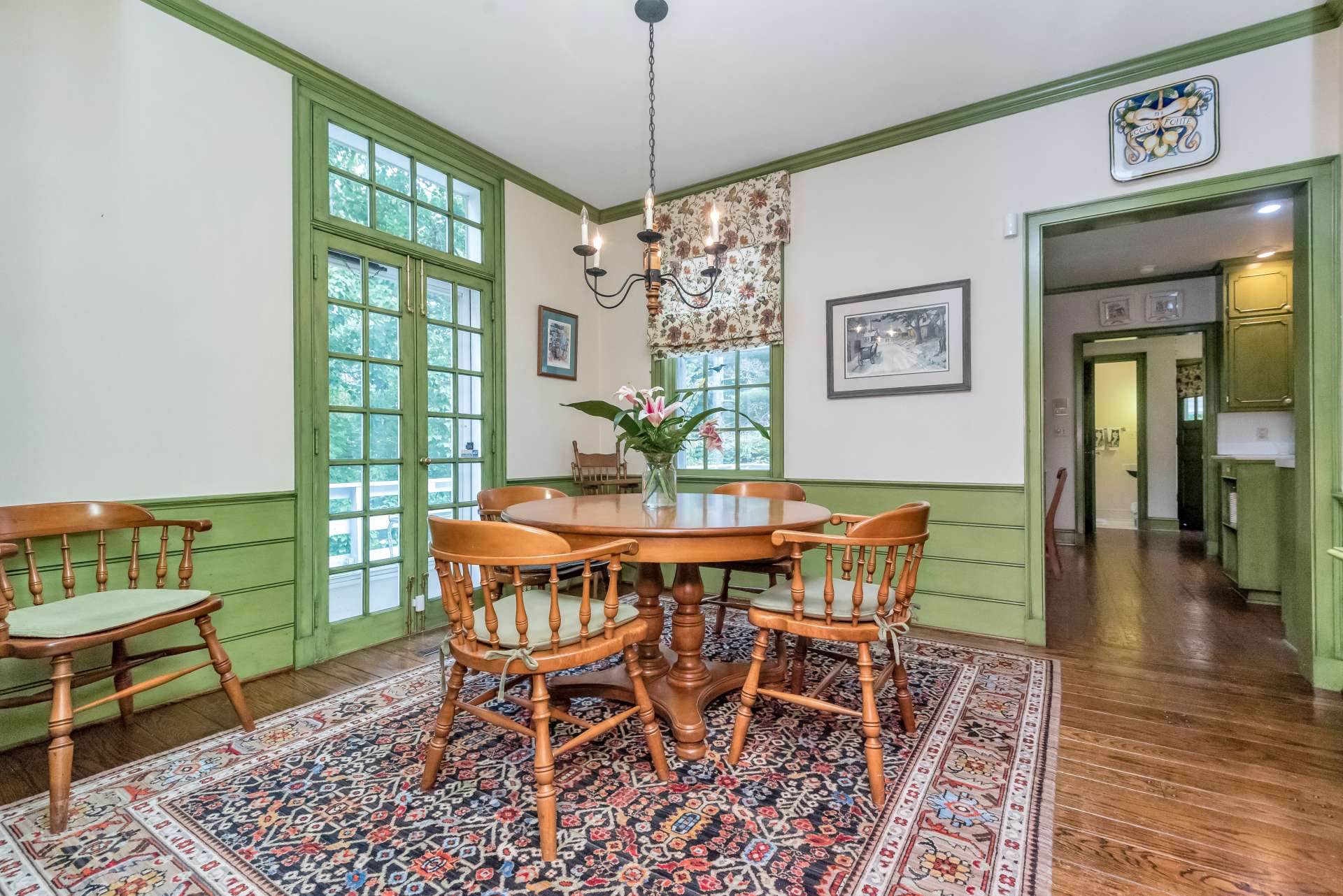 You will delight in the cozy breakfast room with double doors leading to the open deck. On the wall on the left, you will find hand-crafted built-in cabinets for added storage.