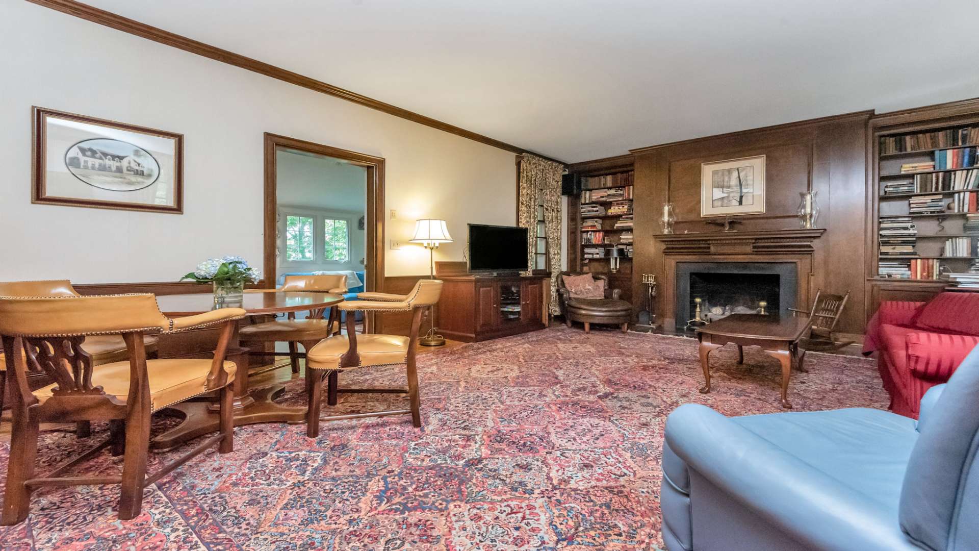 This is the den, or study, where you will find the second fireplace, custom woodworks, and the ideal place to unwind or engage in lively conversations while entertaining family and friends.