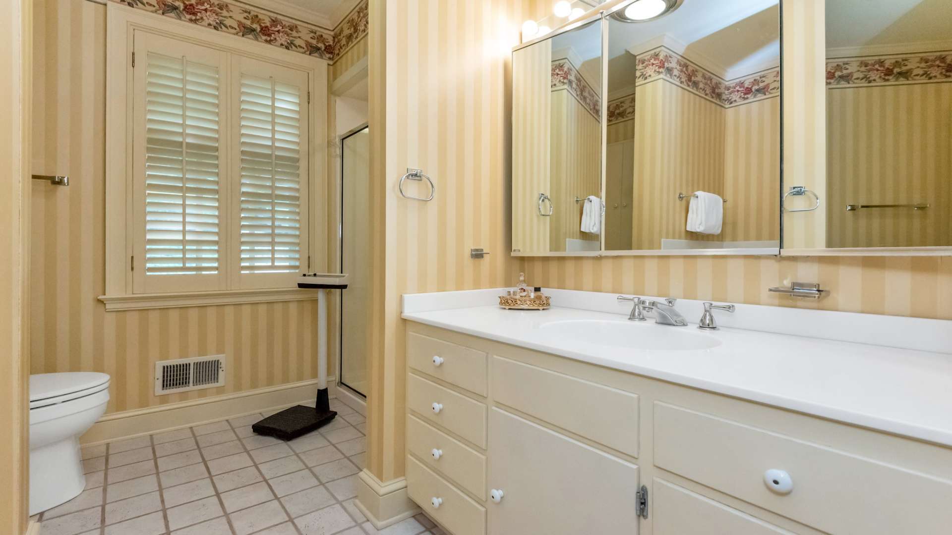 Primary Bedroom ensuite bath with double vanity, tub, and separate shower.