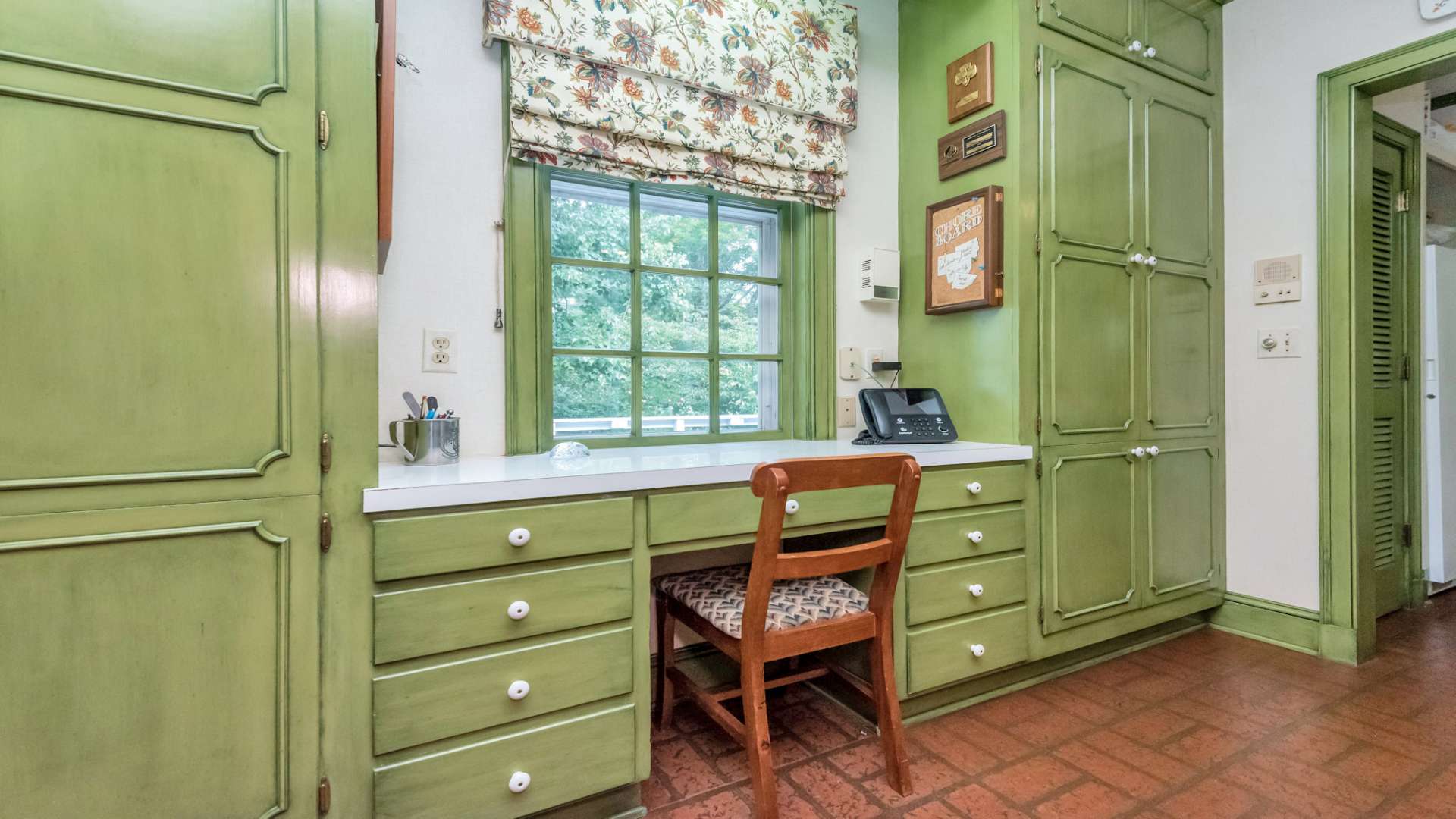 The kitchen also includes a desk area for compiling and documenting those secret family recipes.