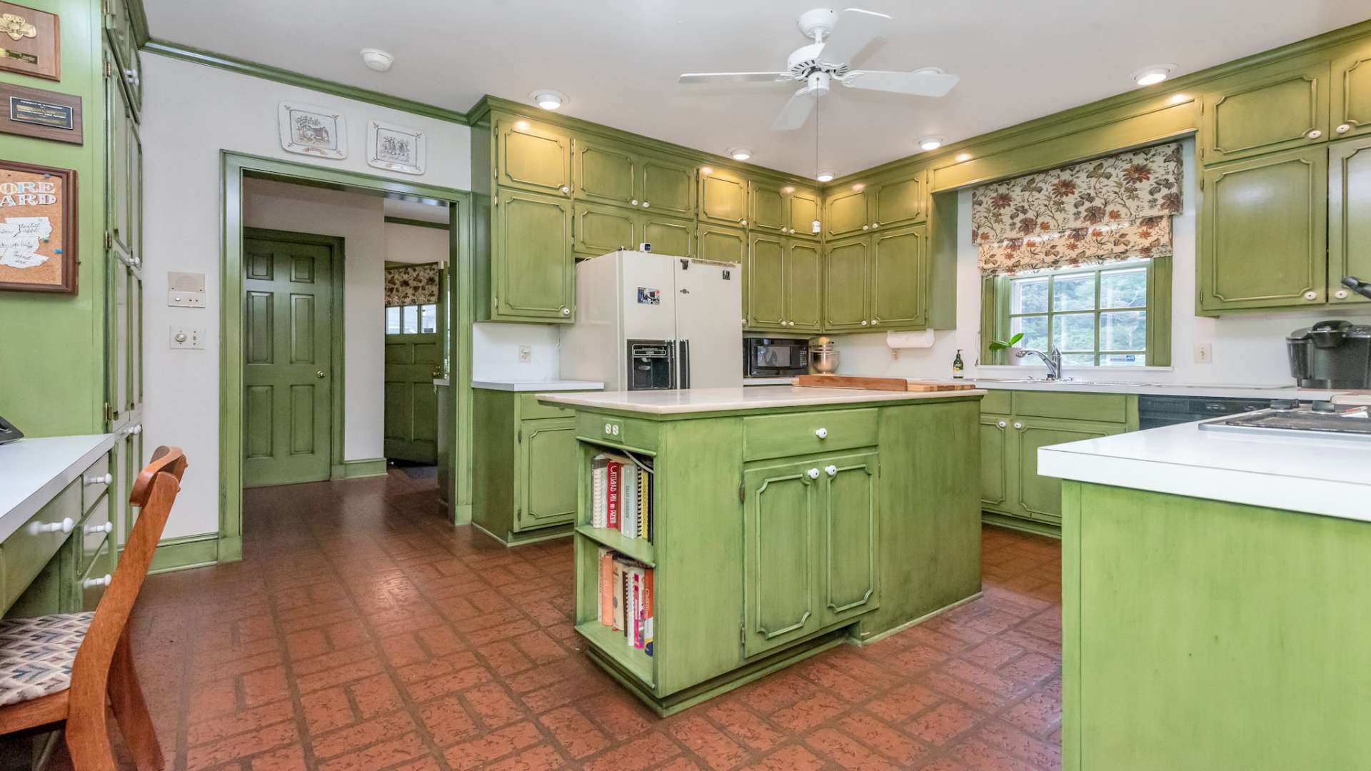 The kitchen continues the Virginia colonial influence and offers more than ample work and storage space.