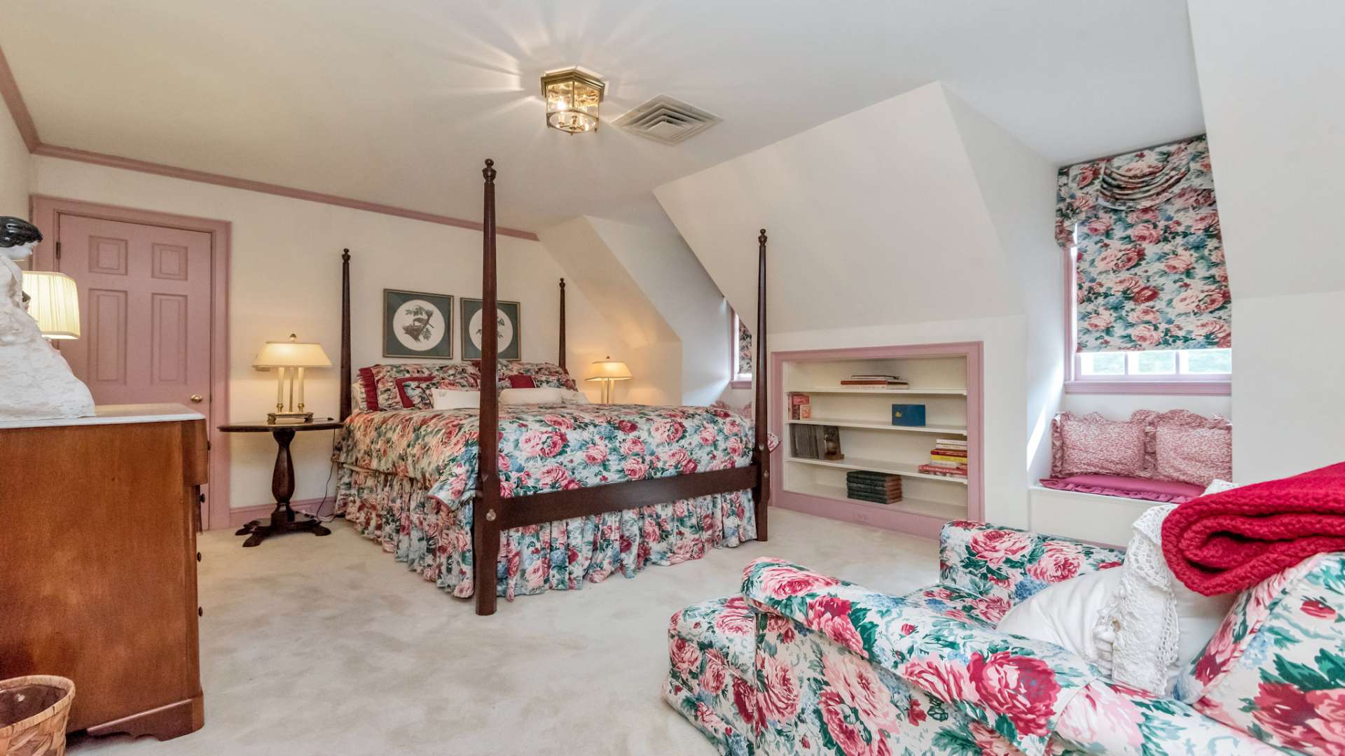 This spacious upper level bedroom features window seats with storage, and shares a Jack and Jill bathroom with the second upper level bedroom.