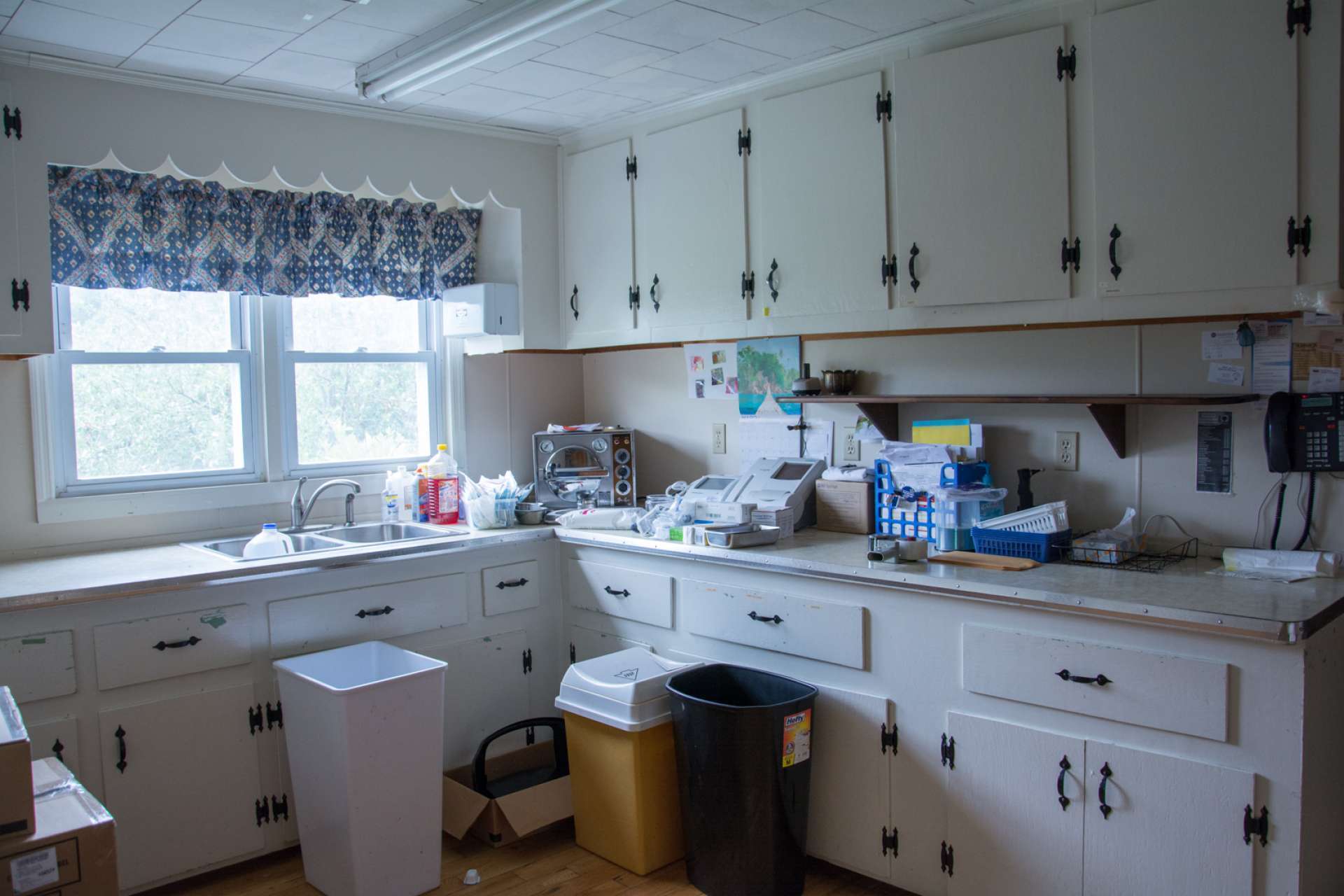 There is a kitchen with both upper and lower cabinets for lots of storage or lunch area.