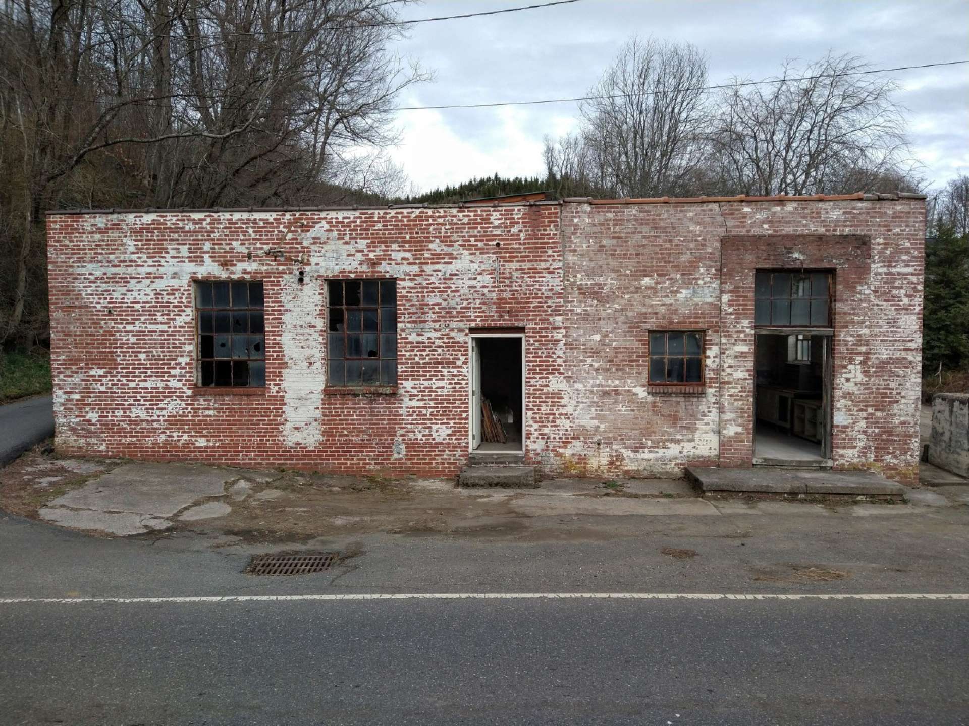 Lots of possibilities for this unique, old historic industrial space.  Convert to residential for a truly unique home with history as a cheese factory.  Lansing is a charming small town nestled in the High Country in the Blue Ridge Mountains of Western North Carolina and a prime travel destination in Ashe County.