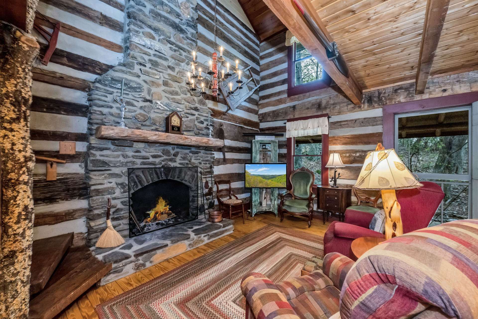 Step inside to be greeted by the rustic charm of the 2 story stone fireplace.