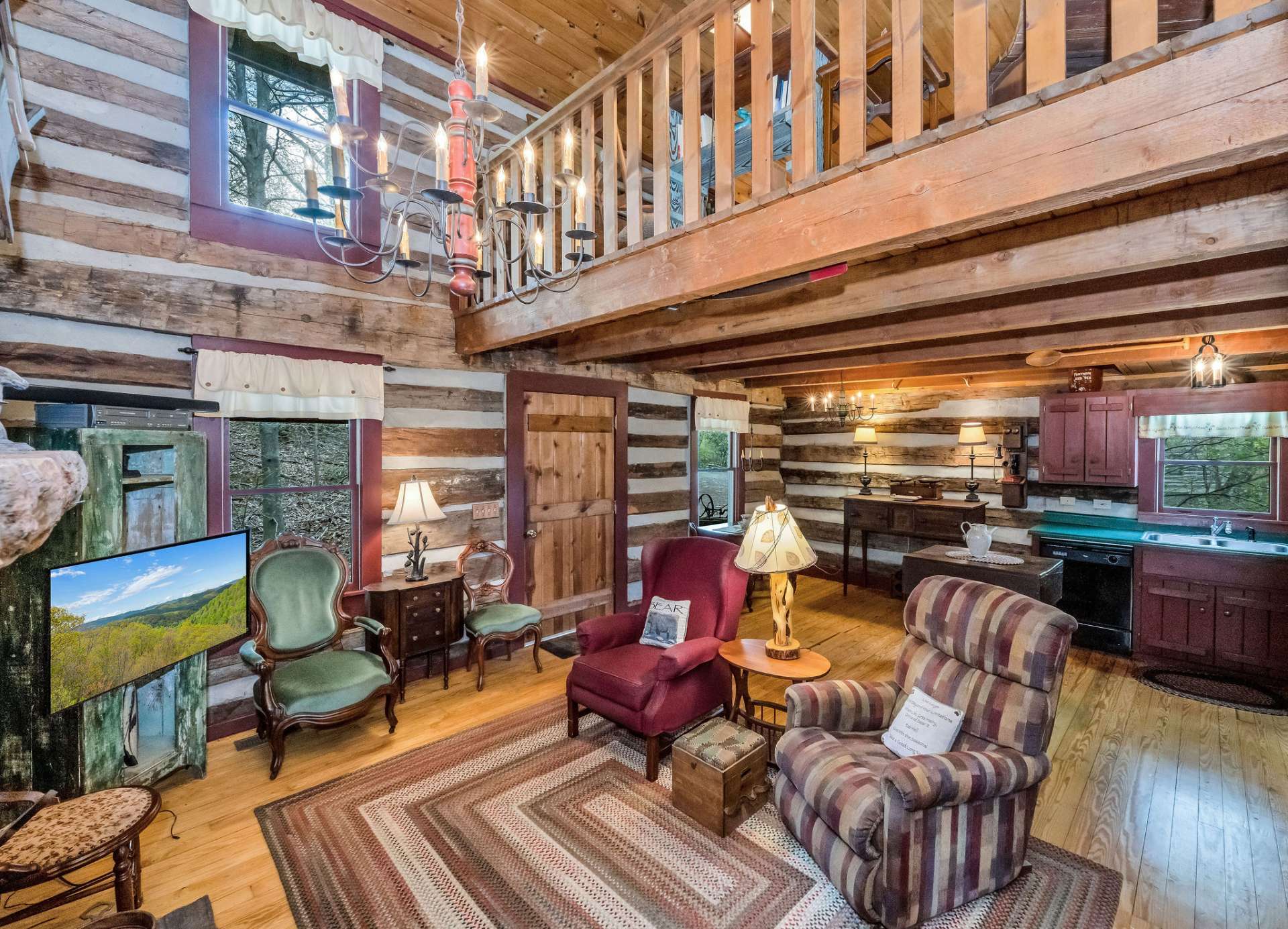 This storybook cabin offers a unique charm with it's painted windows, cabinets, and trim.