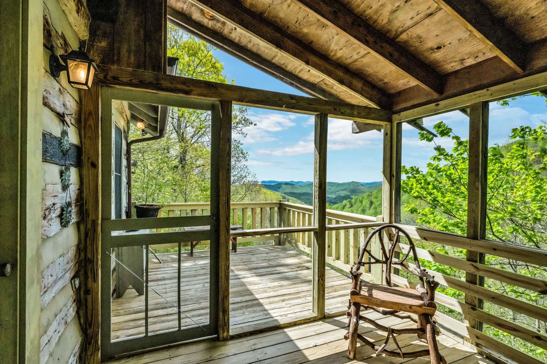 The all weather screened porch opens up to a sun deck with layered vistas that will keep you excited about each trip to your mountain cabin.