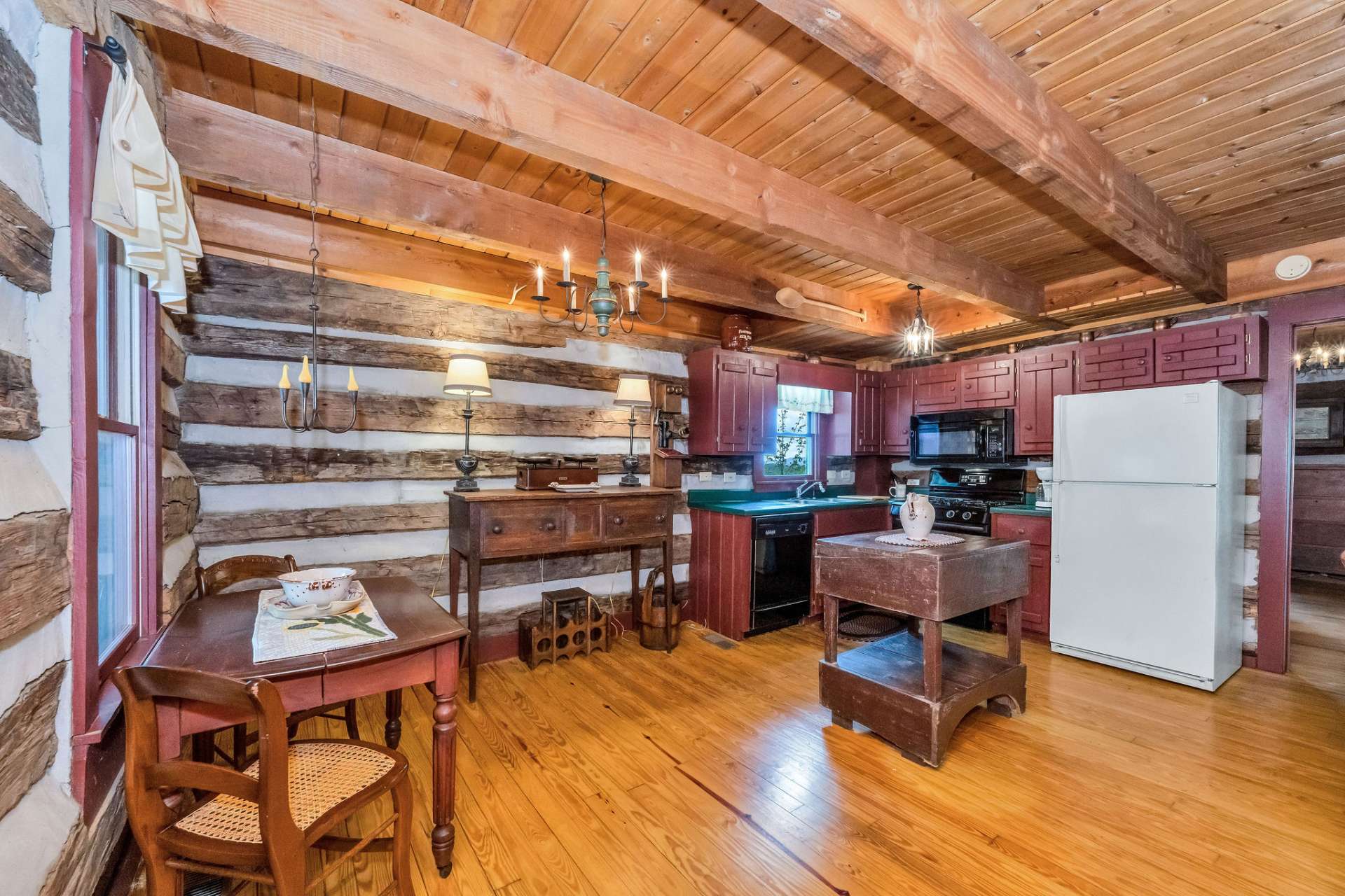 The kitchen, with its picturesque window framing the serene view, makes meal preparation a magical experience.