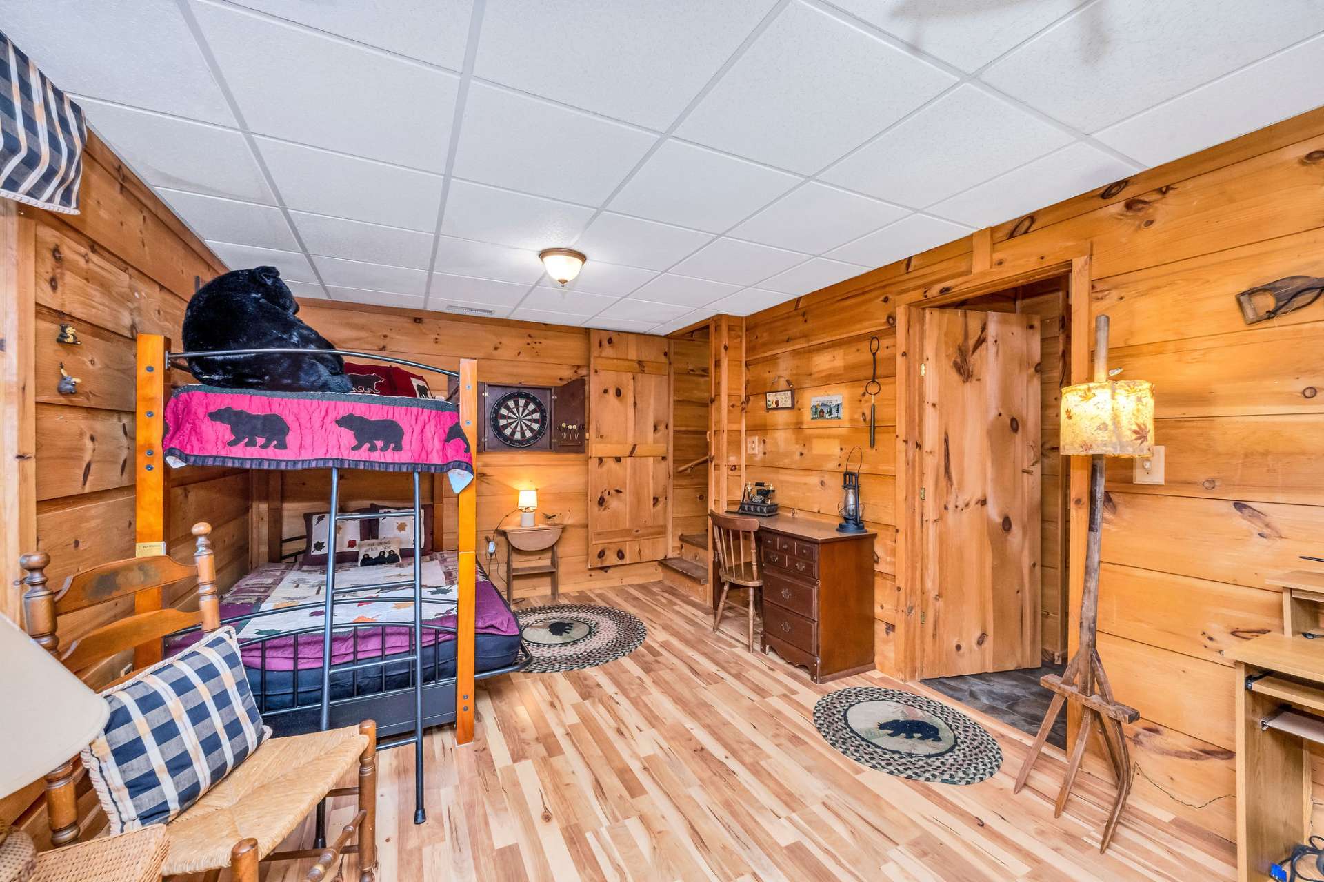 This space is currently multifunctional serving as additional sleeping area, game room, and office.