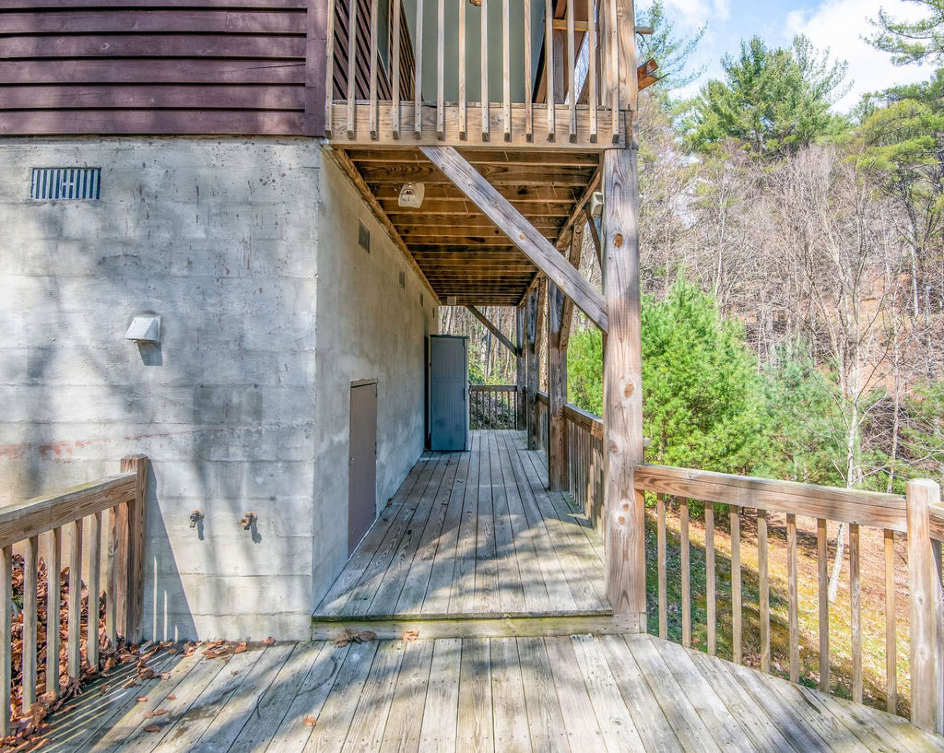 The lower deck has ample space for your outdoor cooking tools and there are hot and cold water hook-ups - great place for a hot tub!