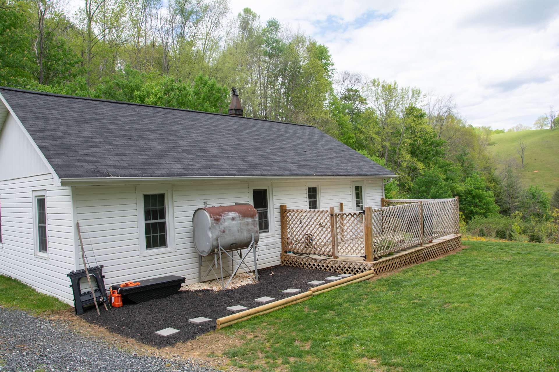 The back deck and yard are perfect for grilling, dining and entertaining outdoors.