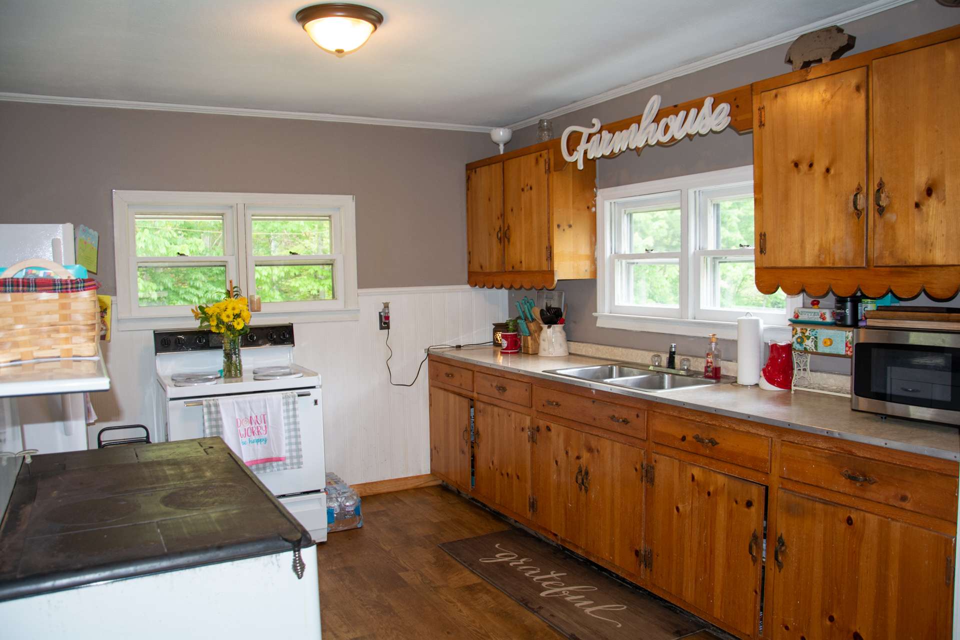 You will fall in love with farmhouse style kitchen complete with operational antique wood cook stove.