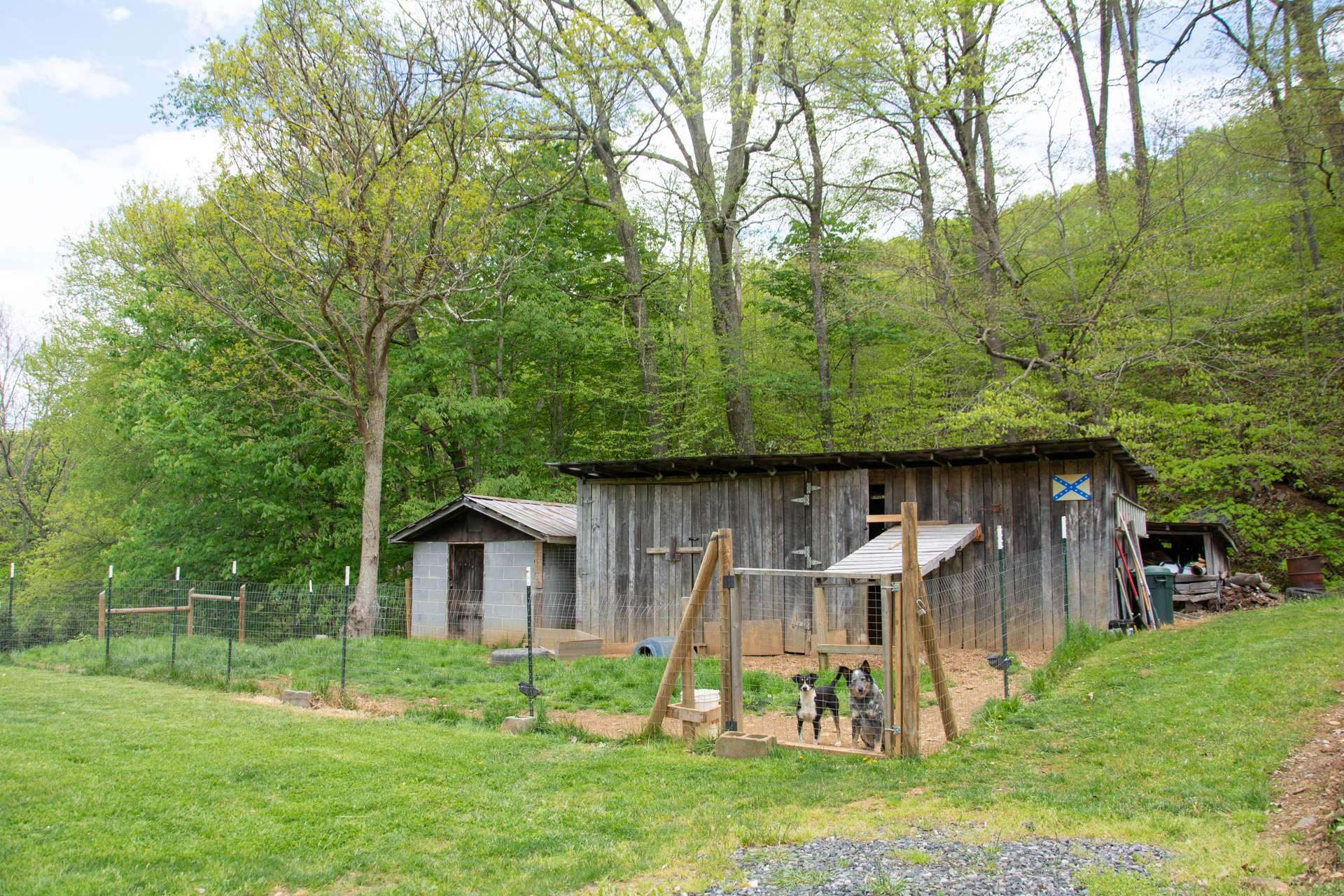 There are outbuildings, and this fenced in dog lot for your furry friends.