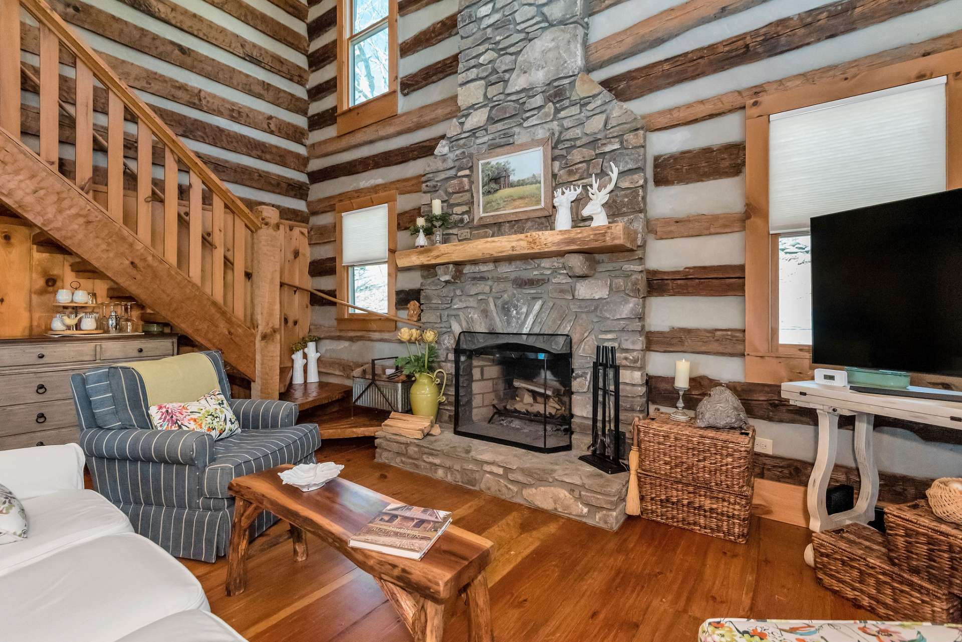 Enjoy the warmth and ambiance of this two-story native stone wood-burning fireplace