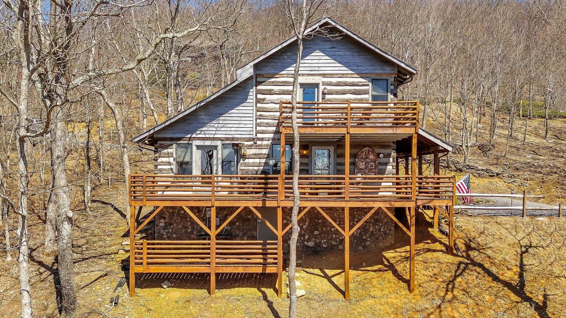 Three layers of deck to celebrate mountain living in the High Country. Lower level deck has access to crawlspace with room for small workshop.