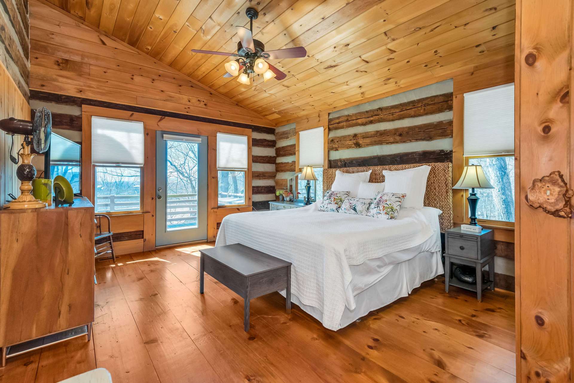 The main level primary suite has direct access to the open deck with ample windows allowing the natural light to radiate through your sanctuary.
