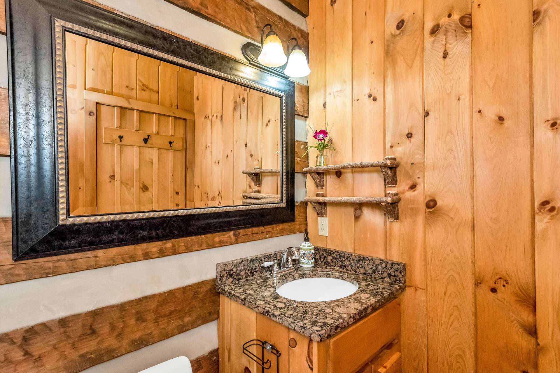 The loft features a full bath with a granite vanity top.