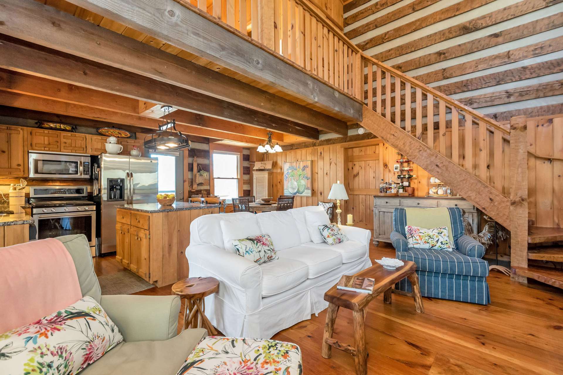 Hand-hewn staircase leads to an open loft.