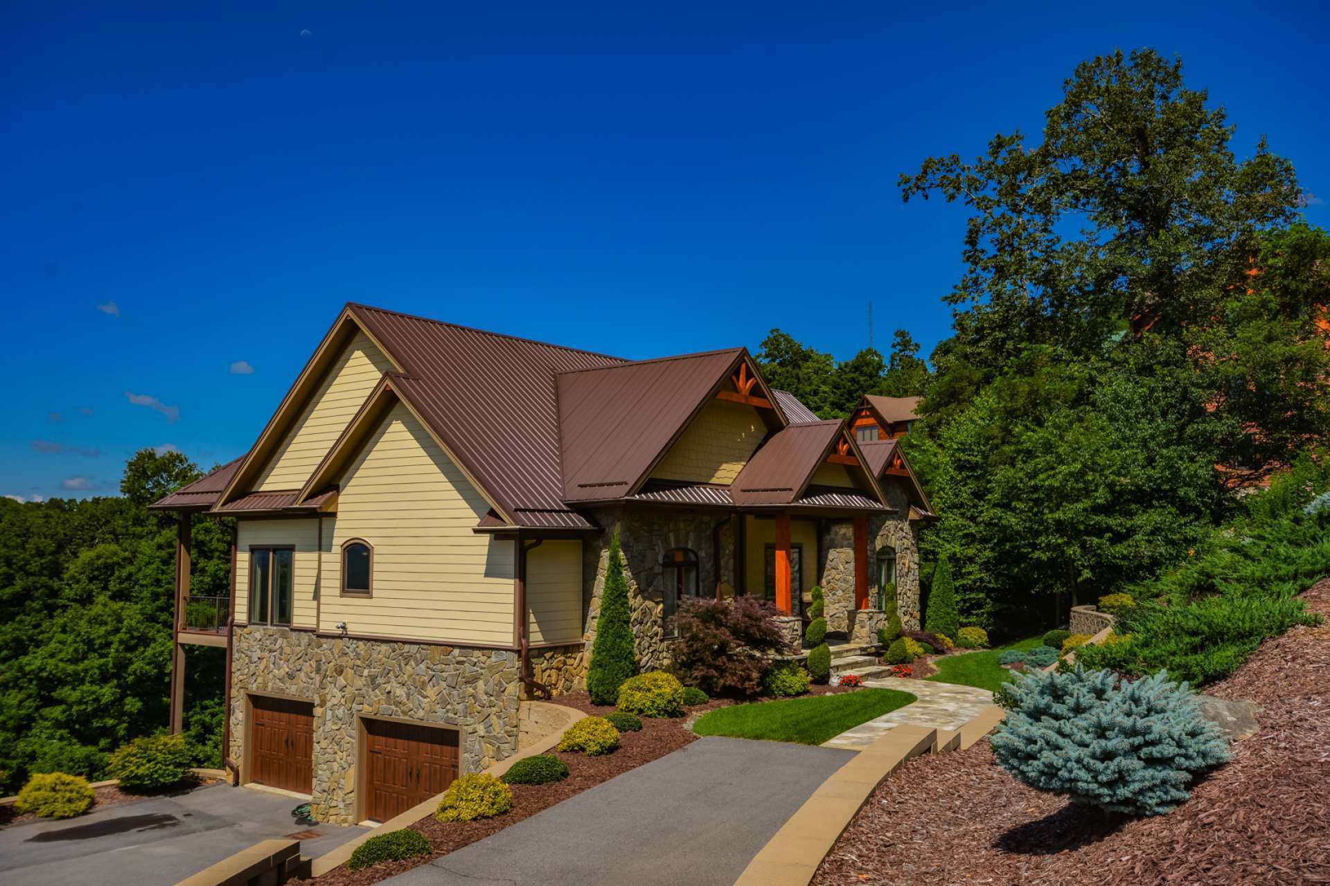 There is plenty of paved parking space leading to the oversized 2-car garage with utility room all protected with a security system.