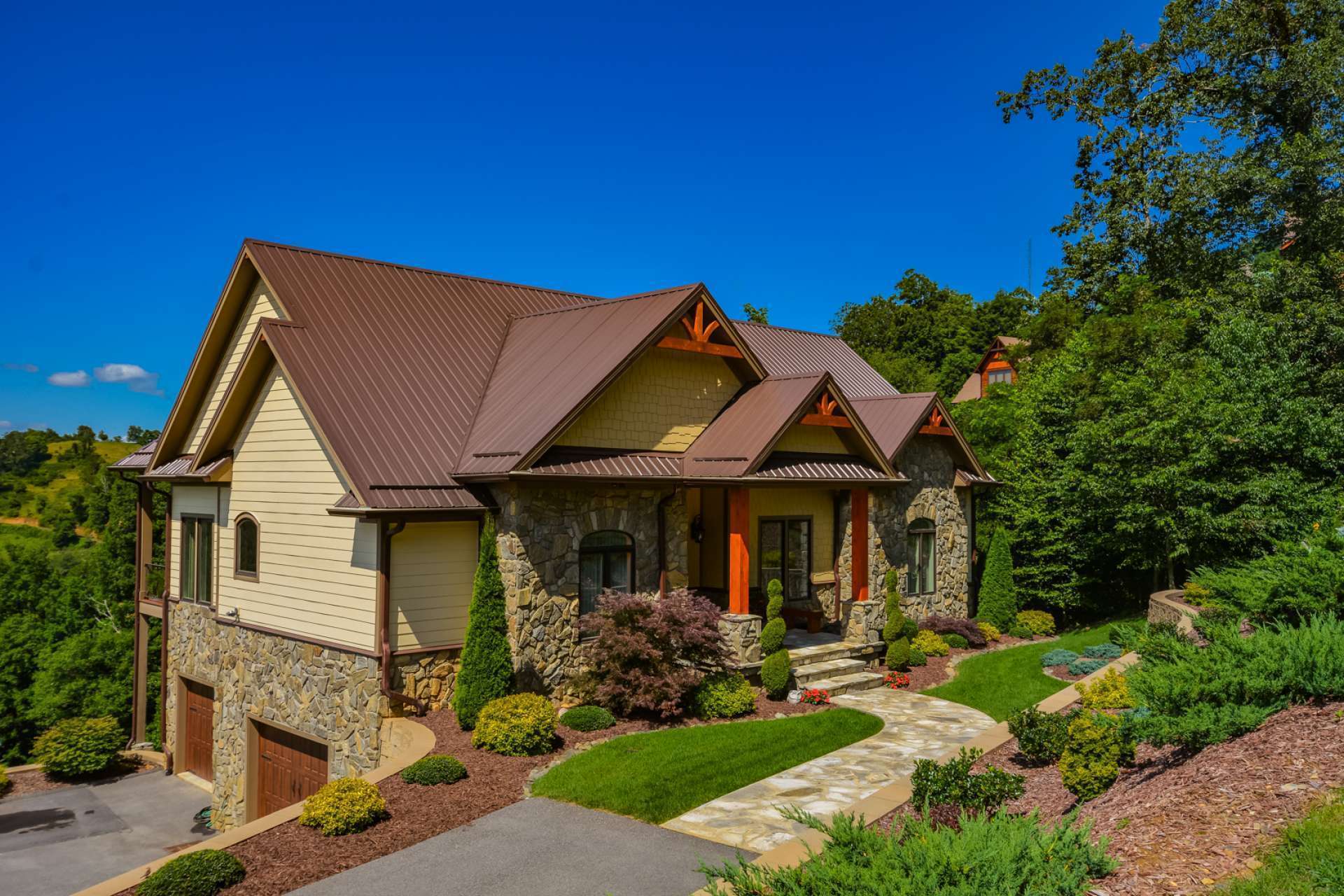 If you came to the mountains for breathtaking views, you must not miss this one-of-a-kind 3-bedroom, 2.5-bath craftsman-style home located in the prestigious Elk Ridge community of Todd in Southern Ashe County, NC.